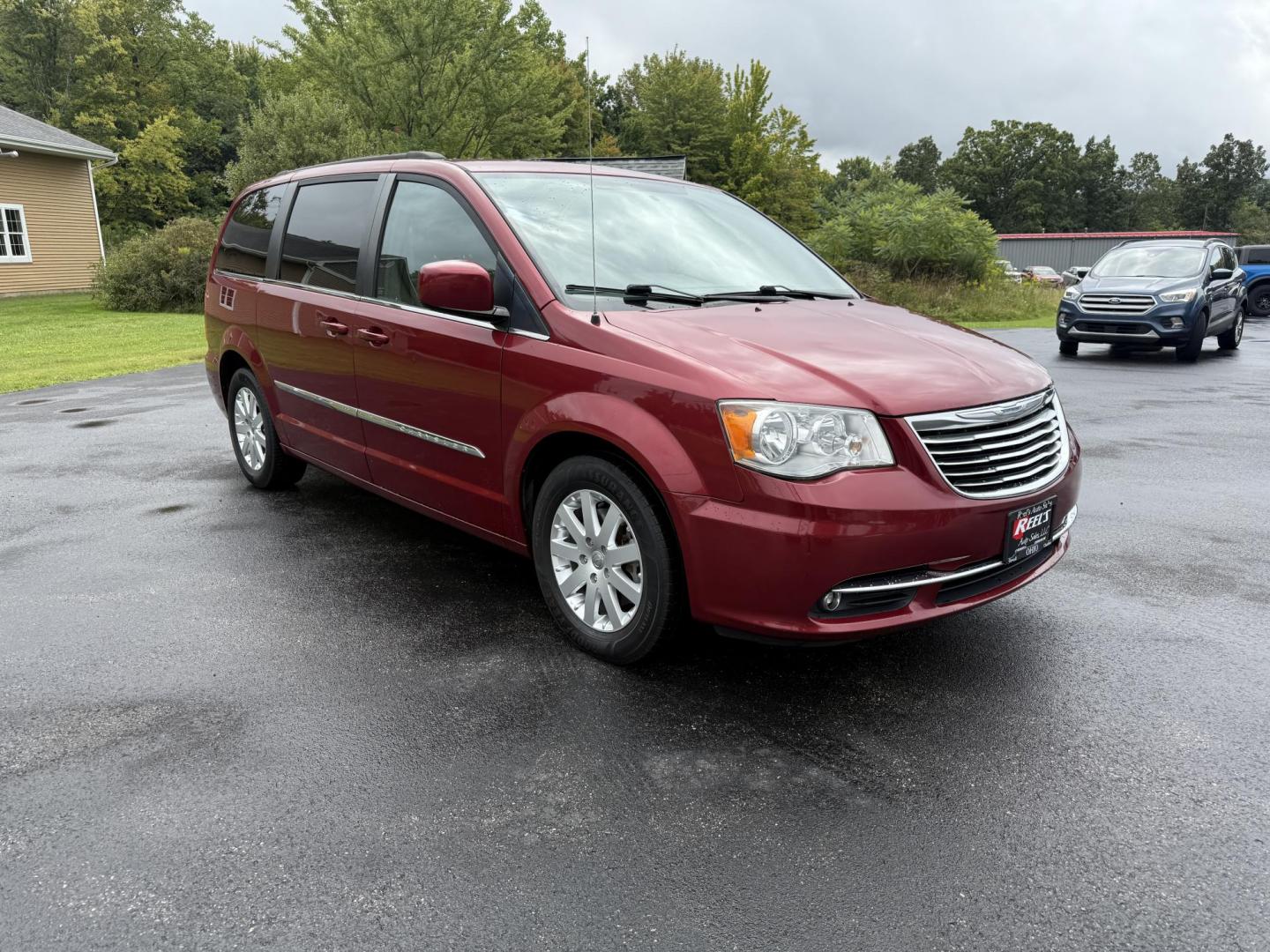 2015 Red /Tan Chrysler Town & Country Touring (2C4RC1BG5FR) with an 3.6L V6 DOHC 24V engine, 6-Speed Automatic transmission, located at 547 E. Main St., Orwell, OH, 44076, (440) 437-5893, 41.535435, -80.847855 - This 2015 Chrysler Town & Country Touring came from Maryland and it shows underneath, equipped with a 3.6L Pentastar V6 engine and 6-speed automatic transmission, offers a luxurious and versatile minivan experience with features like leather interior, tri-zone automatic climate control, power driver - Photo#2