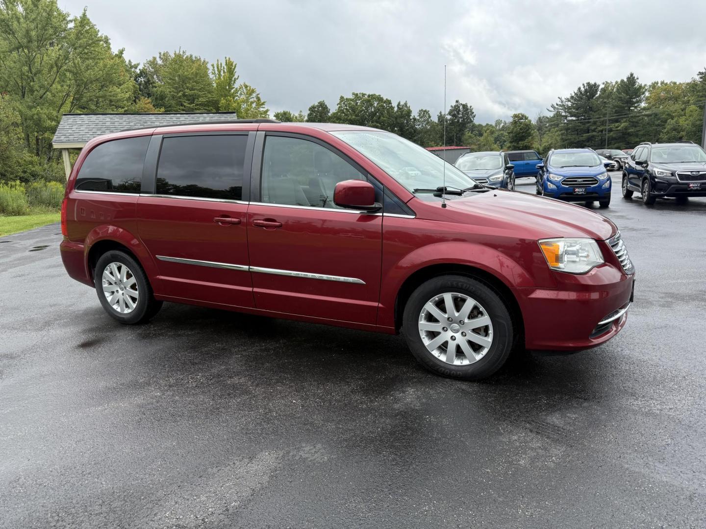 2015 Red /Tan Chrysler Town & Country Touring (2C4RC1BG5FR) with an 3.6L V6 DOHC 24V engine, 6-Speed Automatic transmission, located at 547 E. Main St., Orwell, OH, 44076, (440) 437-5893, 41.535435, -80.847855 - This 2015 Chrysler Town & Country Touring came from Maryland and it shows underneath, equipped with a 3.6L Pentastar V6 engine and 6-speed automatic transmission, offers a luxurious and versatile minivan experience with features like leather interior, tri-zone automatic climate control, power driver - Photo#3