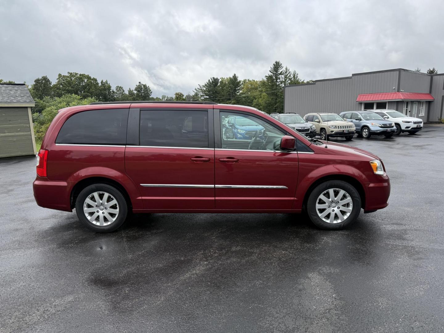 2015 Red /Tan Chrysler Town & Country Touring (2C4RC1BG5FR) with an 3.6L V6 DOHC 24V engine, 6-Speed Automatic transmission, located at 547 E. Main St., Orwell, OH, 44076, (440) 437-5893, 41.535435, -80.847855 - This 2015 Chrysler Town & Country Touring came from Maryland and it shows underneath, equipped with a 3.6L Pentastar V6 engine and 6-speed automatic transmission, offers a luxurious and versatile minivan experience with features like leather interior, tri-zone automatic climate control, power driver - Photo#5