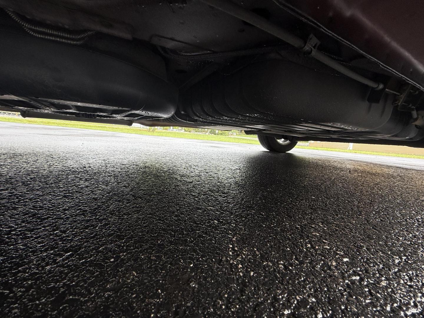 2015 Red /Tan Chrysler Town & Country Touring (2C4RC1BG5FR) with an 3.6L V6 DOHC 24V engine, 6-Speed Automatic transmission, located at 547 E. Main St., Orwell, OH, 44076, (440) 437-5893, 41.535435, -80.847855 - This 2015 Chrysler Town & Country Touring came from Maryland and it shows underneath, equipped with a 3.6L Pentastar V6 engine and 6-speed automatic transmission, offers a luxurious and versatile minivan experience with features like leather interior, tri-zone automatic climate control, power driver - Photo#14