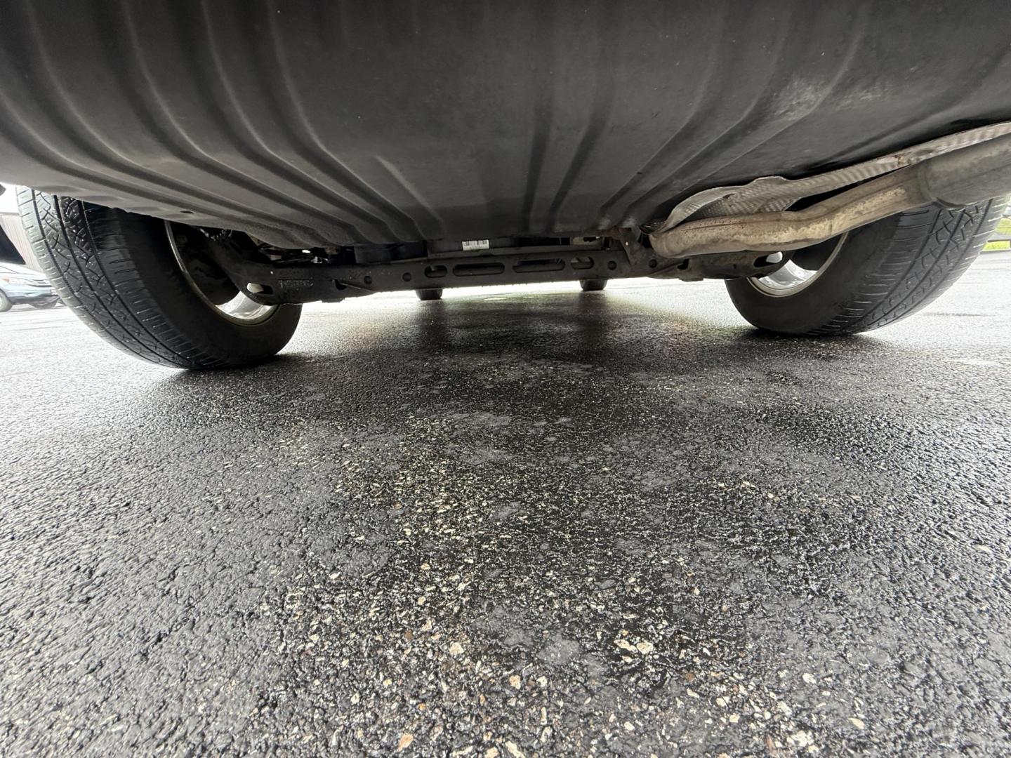 2015 Red /Tan Chrysler Town & Country Touring (2C4RC1BG5FR) with an 3.6L V6 DOHC 24V engine, 6-Speed Automatic transmission, located at 547 E. Main St., Orwell, OH, 44076, (440) 437-5893, 41.535435, -80.847855 - This 2015 Chrysler Town & Country Touring came from Maryland and it shows underneath, equipped with a 3.6L Pentastar V6 engine and 6-speed automatic transmission, offers a luxurious and versatile minivan experience with features like leather interior, tri-zone automatic climate control, power driver - Photo#15