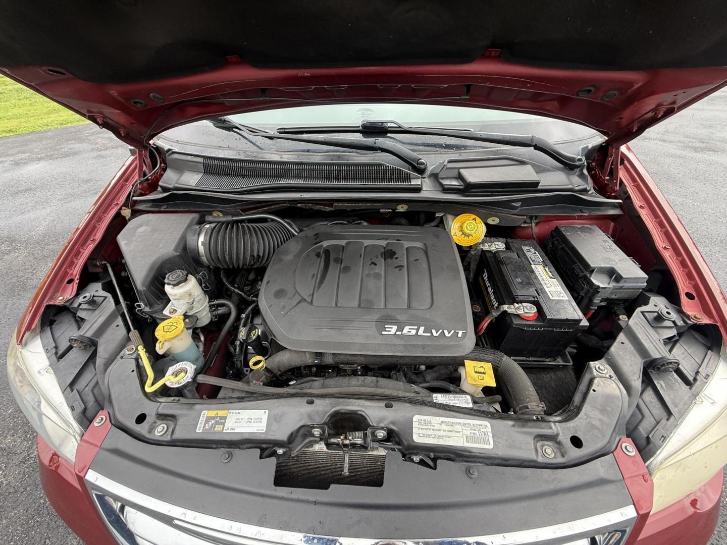 2015 Red /Tan Chrysler Town & Country Touring (2C4RC1BG5FR) with an 3.6L V6 DOHC 24V engine, 6-Speed Automatic transmission, located at 547 E. Main St., Orwell, OH, 44076, (440) 437-5893, 41.535435, -80.847855 - This 2015 Chrysler Town & Country Touring came from Maryland and it shows underneath, equipped with a 3.6L Pentastar V6 engine and 6-speed automatic transmission, offers a luxurious and versatile minivan experience with features like leather interior, tri-zone automatic climate control, power driver - Photo#17