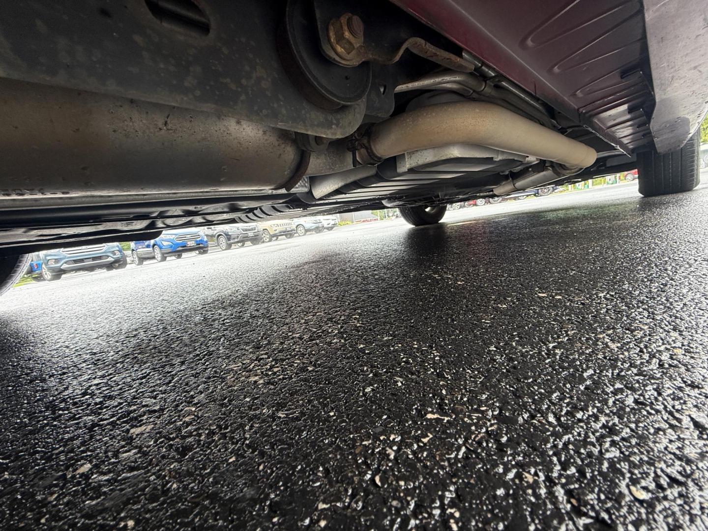 2015 Red /Tan Chrysler Town & Country Touring (2C4RC1BG5FR) with an 3.6L V6 DOHC 24V engine, 6-Speed Automatic transmission, located at 547 E. Main St., Orwell, OH, 44076, (440) 437-5893, 41.535435, -80.847855 - This 2015 Chrysler Town & Country Touring came from Maryland and it shows underneath, equipped with a 3.6L Pentastar V6 engine and 6-speed automatic transmission, offers a luxurious and versatile minivan experience with features like leather interior, tri-zone automatic climate control, power driver - Photo#16