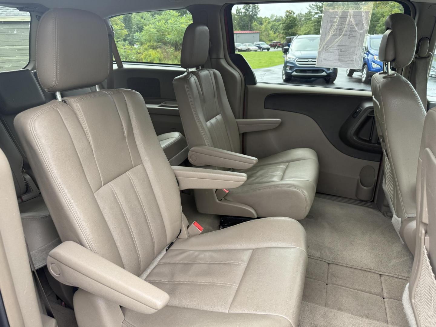 2015 Red /Tan Chrysler Town & Country Touring (2C4RC1BG5FR) with an 3.6L V6 DOHC 24V engine, 6-Speed Automatic transmission, located at 547 E. Main St., Orwell, OH, 44076, (440) 437-5893, 41.535435, -80.847855 - This 2015 Chrysler Town & Country Touring came from Maryland and it shows underneath, equipped with a 3.6L Pentastar V6 engine and 6-speed automatic transmission, offers a luxurious and versatile minivan experience with features like leather interior, tri-zone automatic climate control, power driver - Photo#42