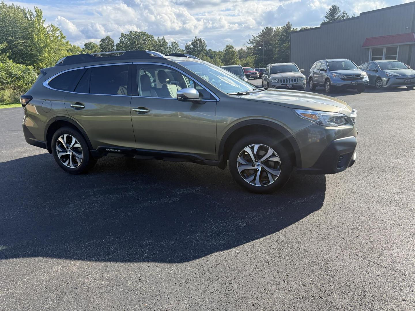 2020 Green /Brown Subaru Outback Touring (4S4BTAPC4L3) with an 2.5L H4 DOHC 16V engine, Automatic transmission, located at 11115 Chardon Rd. , Chardon, OH, 44024, (440) 214-9705, 41.580246, -81.241943 - This One Owner 2020 Subaru Outback Touring with a 2.5L H4 engine and Symmetrical AWD delivers excellent versatility and efficiency, reaching up to 33 MPG highway. It boasts a luxurious leather interior, heated and cooled power front seats, dual-zone automatic climate control, a large 11.6-inch touch - Photo#3