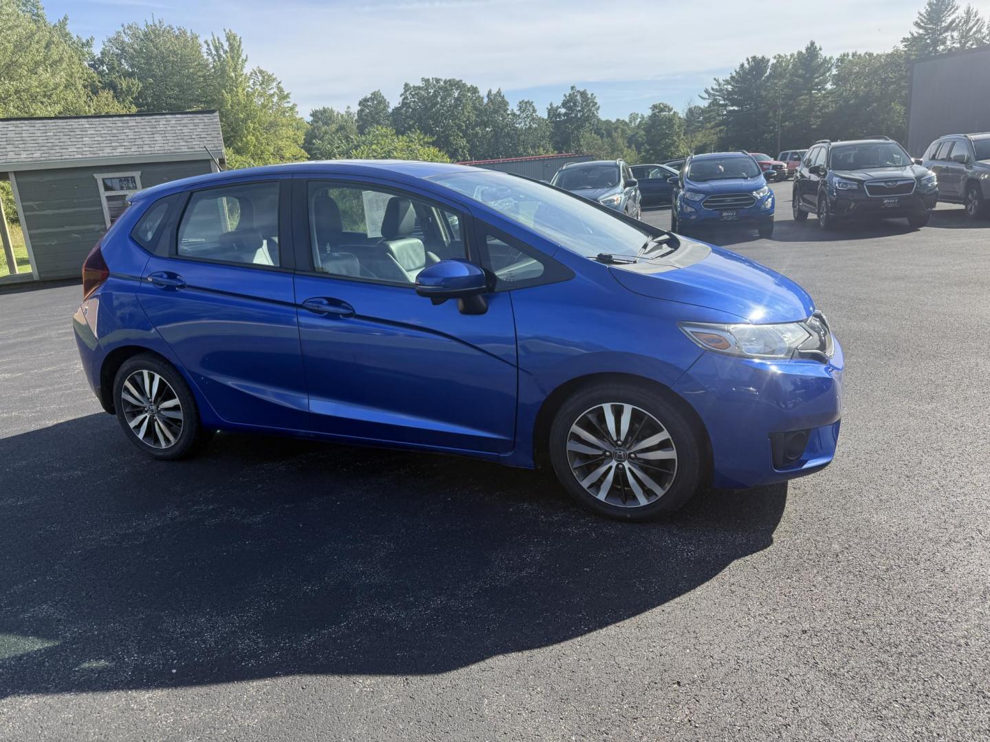 2016 Blue /Black Honda Fit EX-L CVT (3HGGK5H88GM) with an 1.5L I4 SOHC 16V engine, Automatic transmission, located at 11115 Chardon Rd. , Chardon, OH, 44024, (440) 214-9705, 41.580246, -81.241943 - This 2016 Honda Fit EX-L, powered by a 1.5L I4 engine, delivers impressive efficiency with up to 40 MPG highway and packs a surprising array of premium features for its class, including leather interior, heated front seats, a power moonroof, and a 7-inch touchscreen with push-button start. Safety an - Photo#3