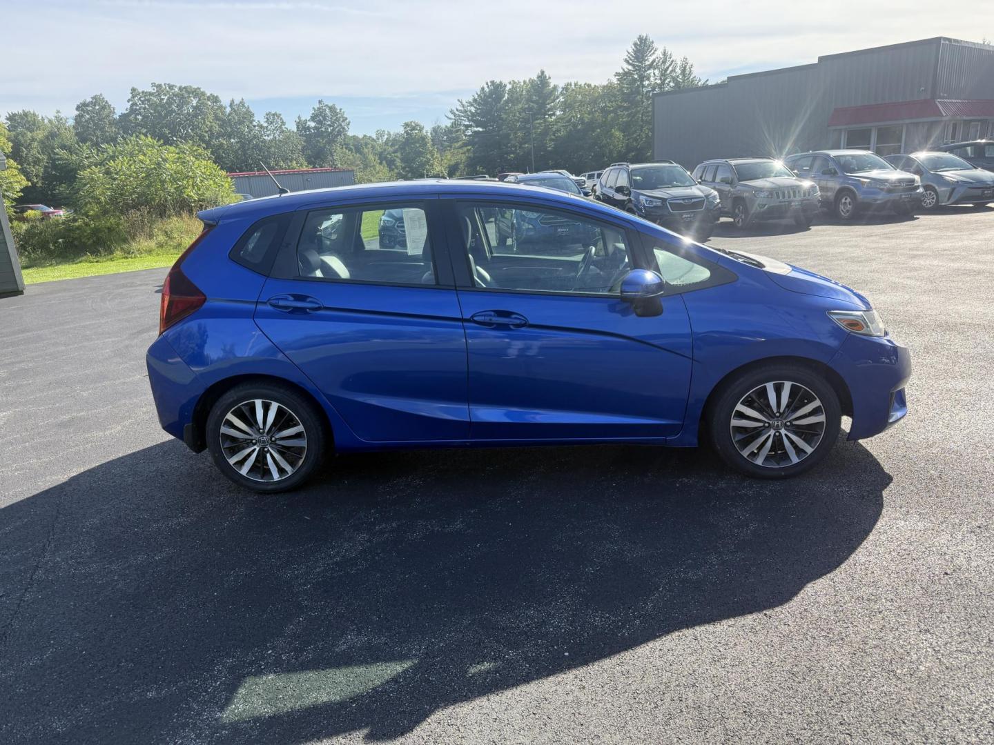2016 Blue /Black Honda Fit EX-L CVT (3HGGK5H88GM) with an 1.5L I4 SOHC 16V engine, Automatic transmission, located at 11115 Chardon Rd. , Chardon, OH, 44024, (440) 214-9705, 41.580246, -81.241943 - This 2016 Honda Fit EX-L, powered by a 1.5L I4 engine, delivers impressive efficiency with up to 40 MPG highway and packs a surprising array of premium features for its class, including leather interior, heated front seats, a power moonroof, and a 7-inch touchscreen with push-button start. Safety an - Photo#5