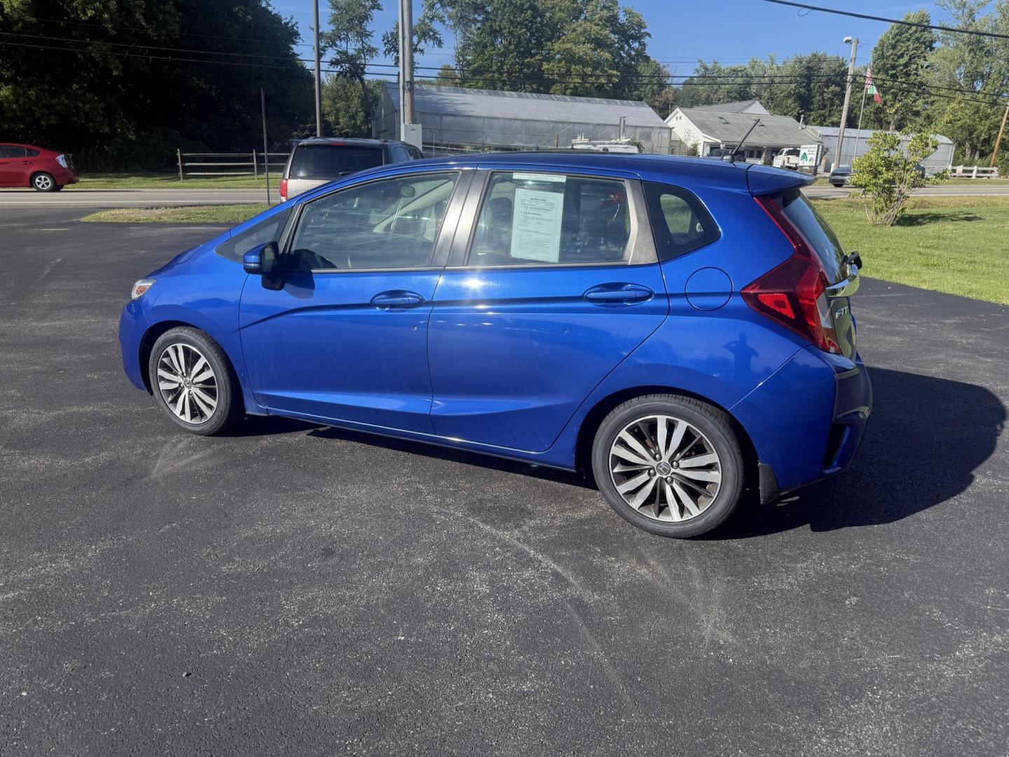 2016 Blue /Black Honda Fit EX-L CVT (3HGGK5H88GM) with an 1.5L I4 SOHC 16V engine, Automatic transmission, located at 11115 Chardon Rd. , Chardon, OH, 44024, (440) 214-9705, 41.580246, -81.241943 - This 2016 Honda Fit EX-L, powered by a 1.5L I4 engine, delivers impressive efficiency with up to 40 MPG highway and packs a surprising array of premium features for its class, including leather interior, heated front seats, a power moonroof, and a 7-inch touchscreen with push-button start. Safety an - Photo#10