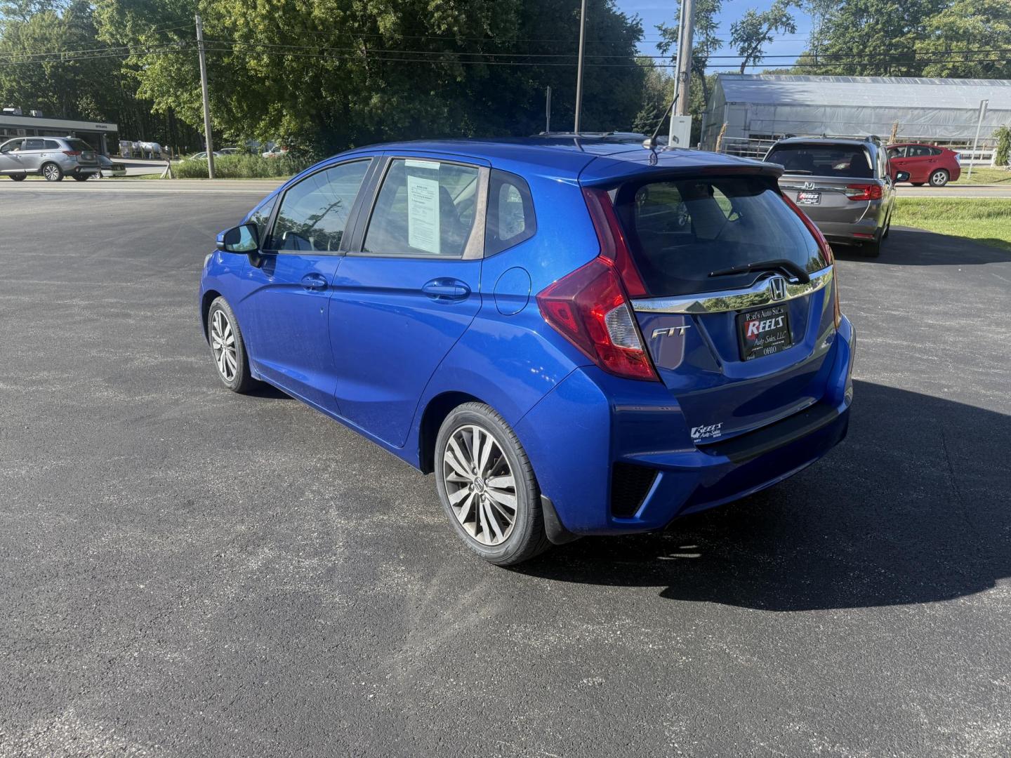 2016 Blue /Black Honda Fit EX-L CVT (3HGGK5H88GM) with an 1.5L I4 SOHC 16V engine, Automatic transmission, located at 11115 Chardon Rd. , Chardon, OH, 44024, (440) 214-9705, 41.580246, -81.241943 - This 2016 Honda Fit EX-L, powered by a 1.5L I4 engine, delivers impressive efficiency with up to 40 MPG highway and packs a surprising array of premium features for its class, including leather interior, heated front seats, a power moonroof, and a 7-inch touchscreen with push-button start. Safety an - Photo#9