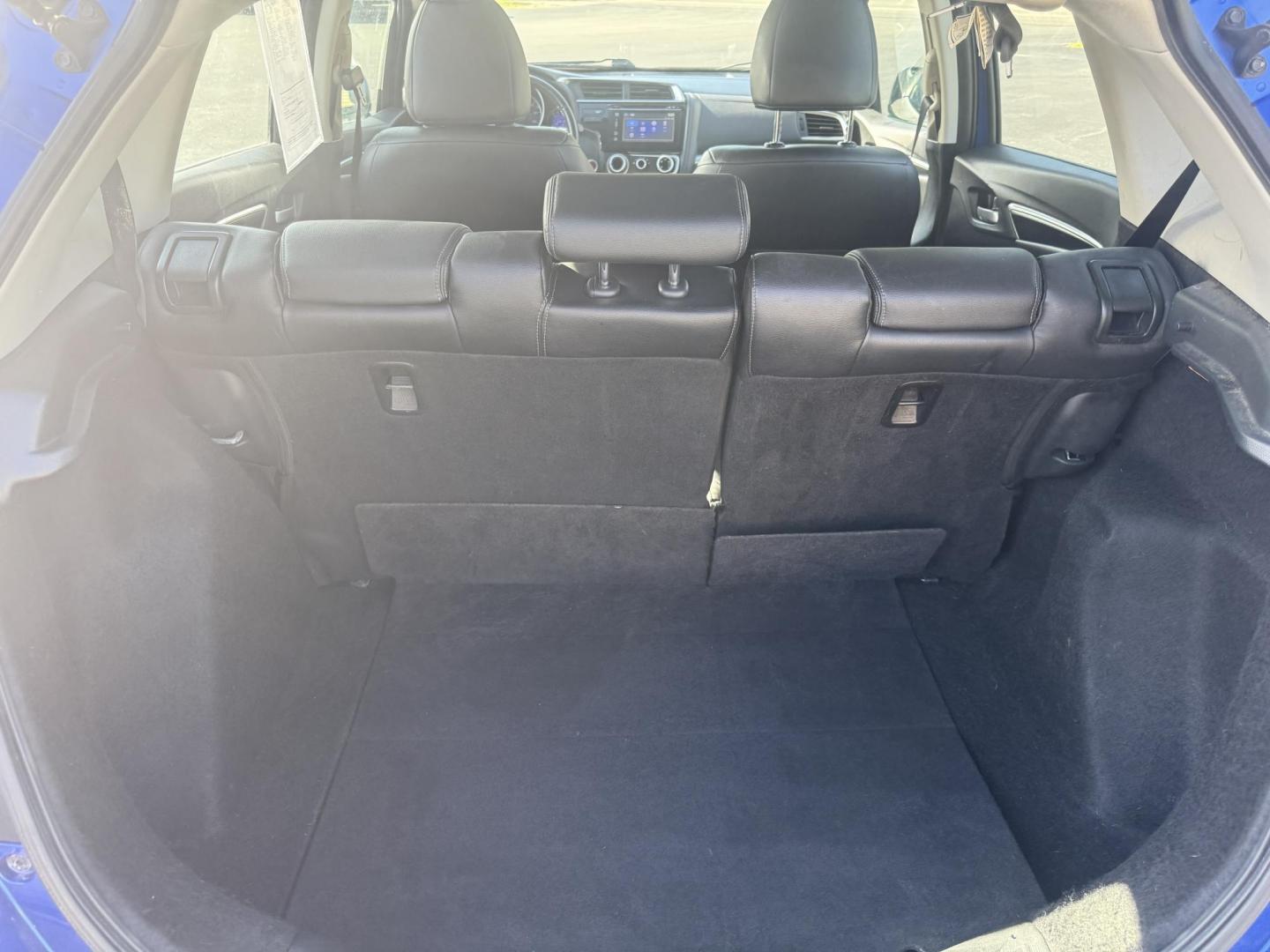 2016 Blue /Black Honda Fit EX-L CVT (3HGGK5H88GM) with an 1.5L I4 SOHC 16V engine, Automatic transmission, located at 11115 Chardon Rd. , Chardon, OH, 44024, (440) 214-9705, 41.580246, -81.241943 - This 2016 Honda Fit EX-L, powered by a 1.5L I4 engine, delivers impressive efficiency with up to 40 MPG highway and packs a surprising array of premium features for its class, including leather interior, heated front seats, a power moonroof, and a 7-inch touchscreen with push-button start. Safety an - Photo#35