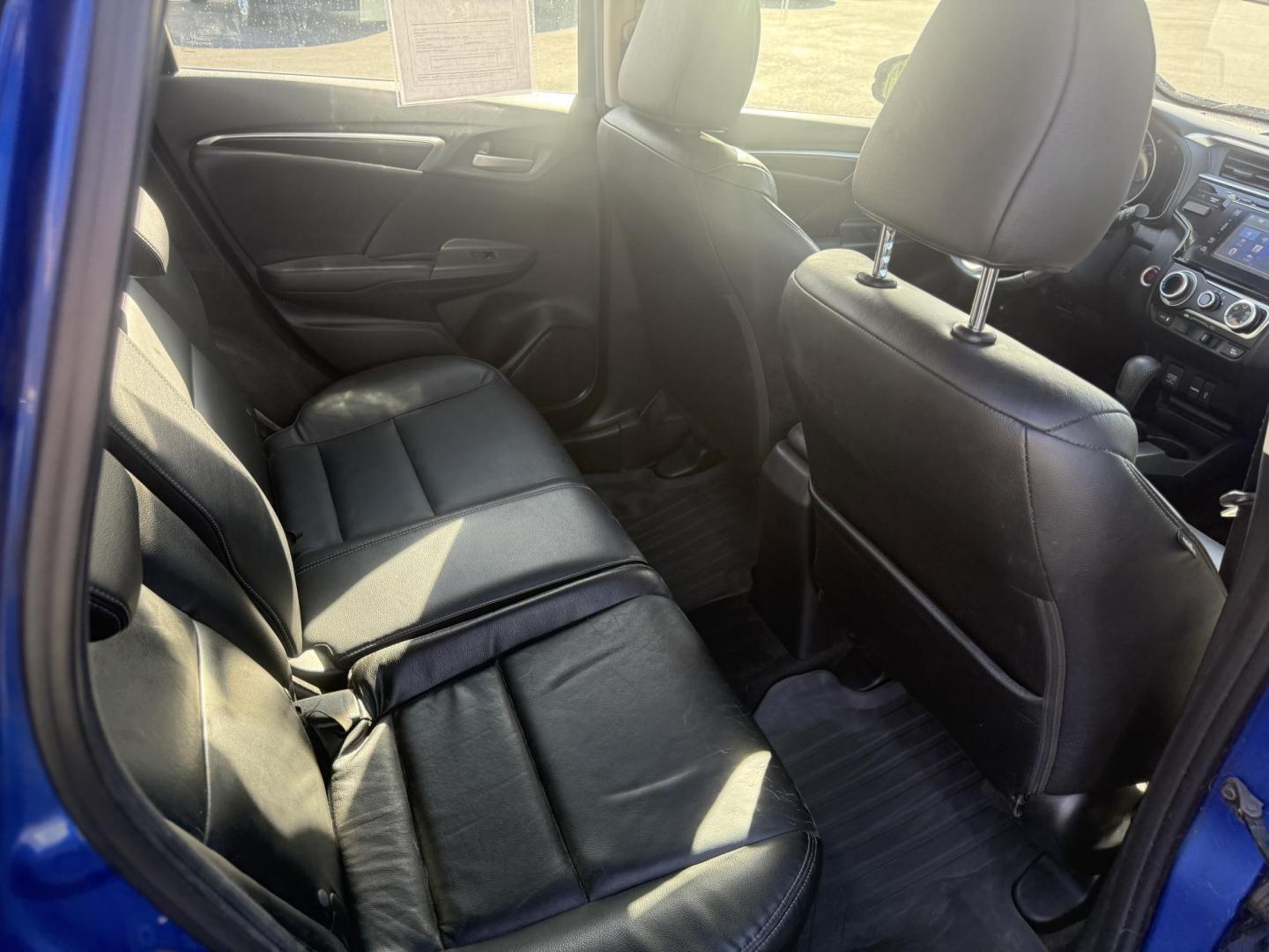 2016 Blue /Black Honda Fit EX-L CVT (3HGGK5H88GM) with an 1.5L I4 SOHC 16V engine, Automatic transmission, located at 11115 Chardon Rd. , Chardon, OH, 44024, (440) 214-9705, 41.580246, -81.241943 - This 2016 Honda Fit EX-L, powered by a 1.5L I4 engine, delivers impressive efficiency with up to 40 MPG highway and packs a surprising array of premium features for its class, including leather interior, heated front seats, a power moonroof, and a 7-inch touchscreen with push-button start. Safety an - Photo#37
