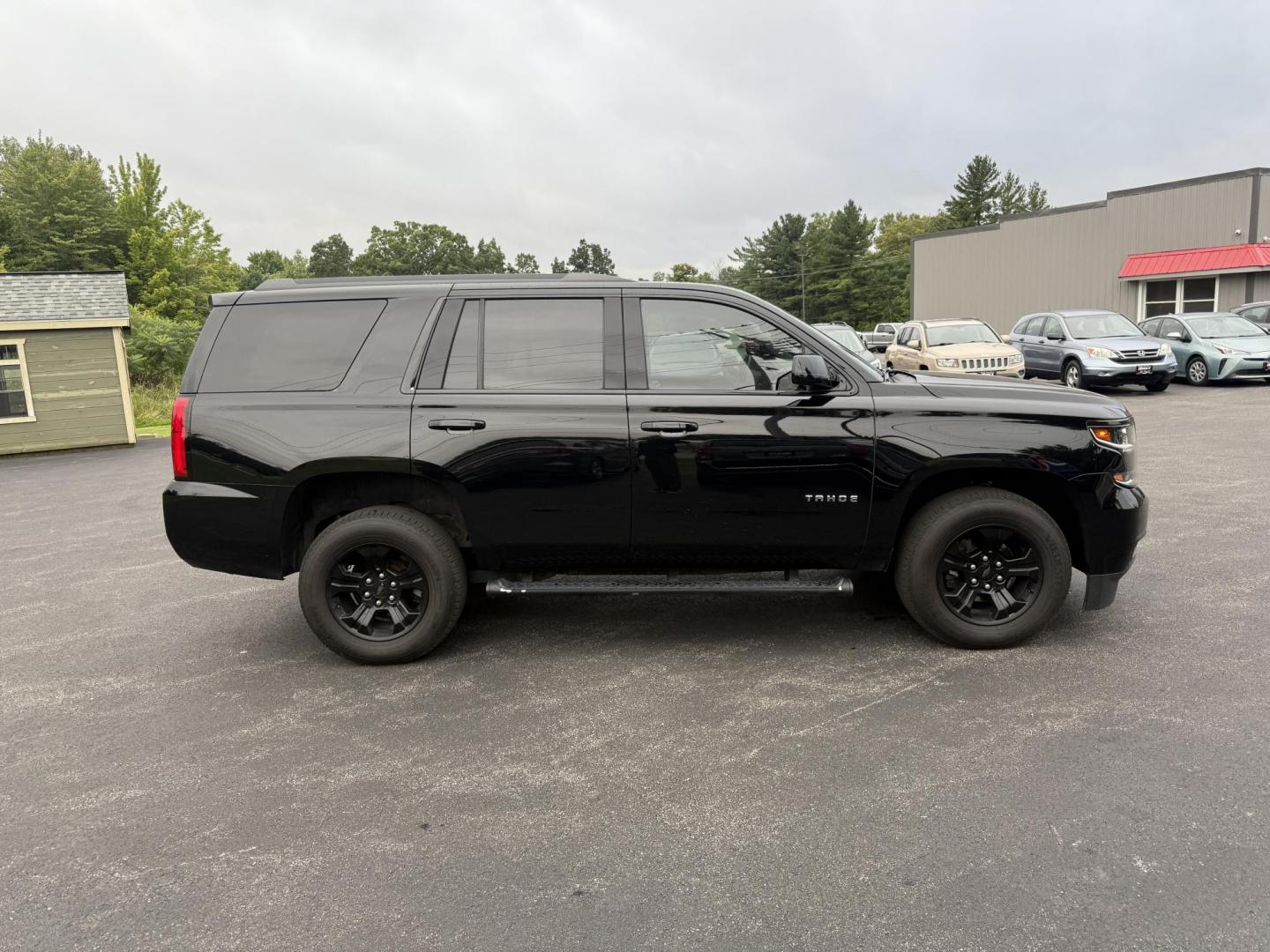 2019 Black /Black Chevrolet Tahoe LS 4WD (1GNSKAKC1KR) with an 5.3L V8 OHV 16V engine, 6A transmission, located at 11115 Chardon Rd. , Chardon, OH, 44024, (440) 214-9705, 41.580246, -81.241943 - This 2019 Chevrolet Tahoe LS 4WD features a robust 5.3L EcoTec3 V8 engine paired with a 6-speed automatic transmission and 3.08 gearing, offering solid performance and a 6,200-pound towing capacity—suitable for family trips and light towing tasks. It comes well-equipped with power front seats, tri - Photo#5