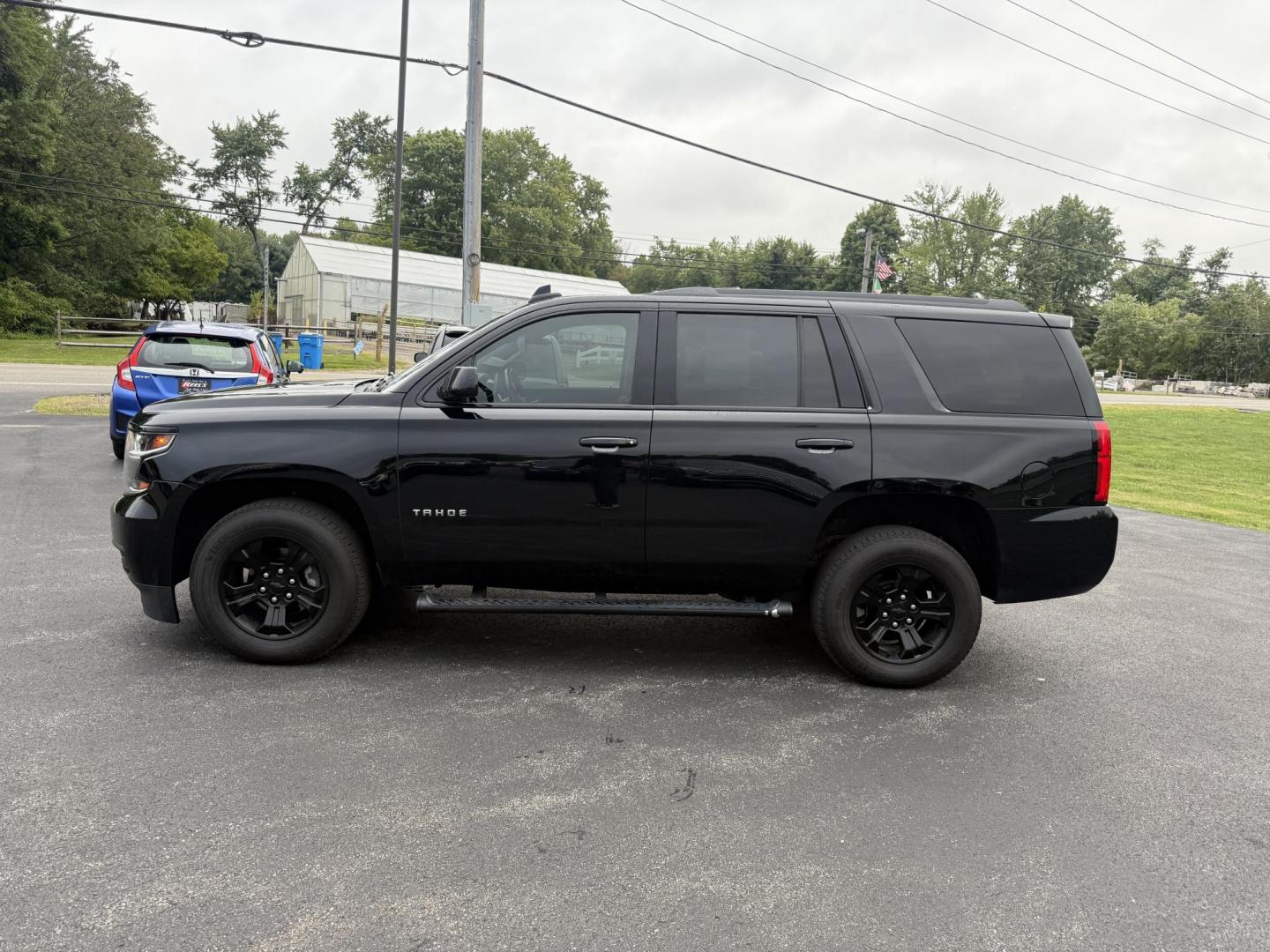 2019 Black /Black Chevrolet Tahoe LS 4WD (1GNSKAKC1KR) with an 5.3L V8 OHV 16V engine, 6A transmission, located at 11115 Chardon Rd. , Chardon, OH, 44024, (440) 214-9705, 41.580246, -81.241943 - This 2019 Chevrolet Tahoe LS 4WD features a robust 5.3L EcoTec3 V8 engine paired with a 6-speed automatic transmission and 3.08 gearing, offering solid performance and a 6,200-pound towing capacity—suitable for family trips and light towing tasks. It comes well-equipped with power front seats, tri - Photo#12