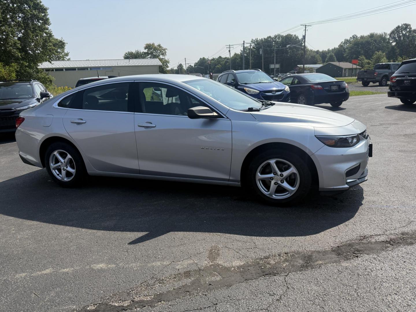 2018 Silver /Black Chevrolet Malibu LS (1G1ZB5ST0JF) with an 1.5L I4 DOHC 16V Turbo engine, 6A transmission, located at 11115 Chardon Rd. , Chardon, OH, 44024, (440) 214-9705, 41.580246, -81.241943 - This 2018 Chevrolet Malibu LS is a fuel-efficient midsize sedan powered by a 1.5L turbocharged EcoTec I4 engine and 6-speed automatic transmission, achieving up to 36 MPG on the highway. It features a 7.0" touchscreen with Apple CarPlay and Android Auto, a 4.2" gauge cluster screen, backup camera, a - Photo#3