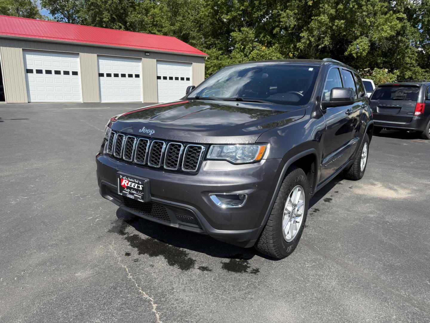 2019 Gray /Black Jeep Grand Cherokee Laredo E 4WD (1C4RJFAG7KC) with an 3.6L V6 DOHC 24V engine, 8A transmission, located at 547 E. Main St., Orwell, OH, 44076, (440) 437-5893, 41.535435, -80.847855 - This 2019 Jeep Grand Cherokee Laredo E 4WD features a 3.6L Pentastar V6 engine with an 8-speed automatic transmission and the Quadra-Trac 1 4WD system, delivering 25 MPG on the highway. Comfort and convenience are provided by a power driver’s seat, dual-zone automatic climate control, a 7.0" touch - Photo#0