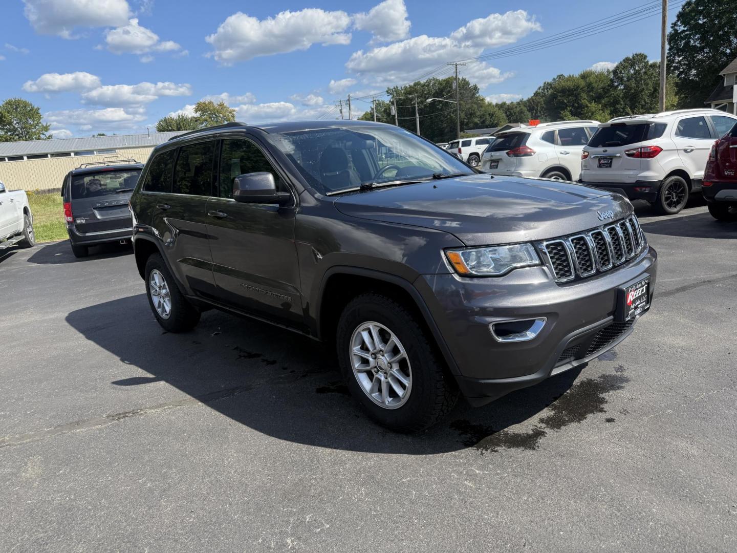 2019 Gray /Black Jeep Grand Cherokee Laredo E 4WD (1C4RJFAG7KC) with an 3.6L V6 DOHC 24V engine, 8A transmission, located at 547 E. Main St., Orwell, OH, 44076, (440) 437-5893, 41.535435, -80.847855 - This 2019 Jeep Grand Cherokee Laredo E 4WD features a 3.6L Pentastar V6 engine with an 8-speed automatic transmission and the Quadra-Trac 1 4WD system, delivering 25 MPG on the highway. Comfort and convenience are provided by a power driver’s seat, dual-zone automatic climate control, a 7.0" touch - Photo#2