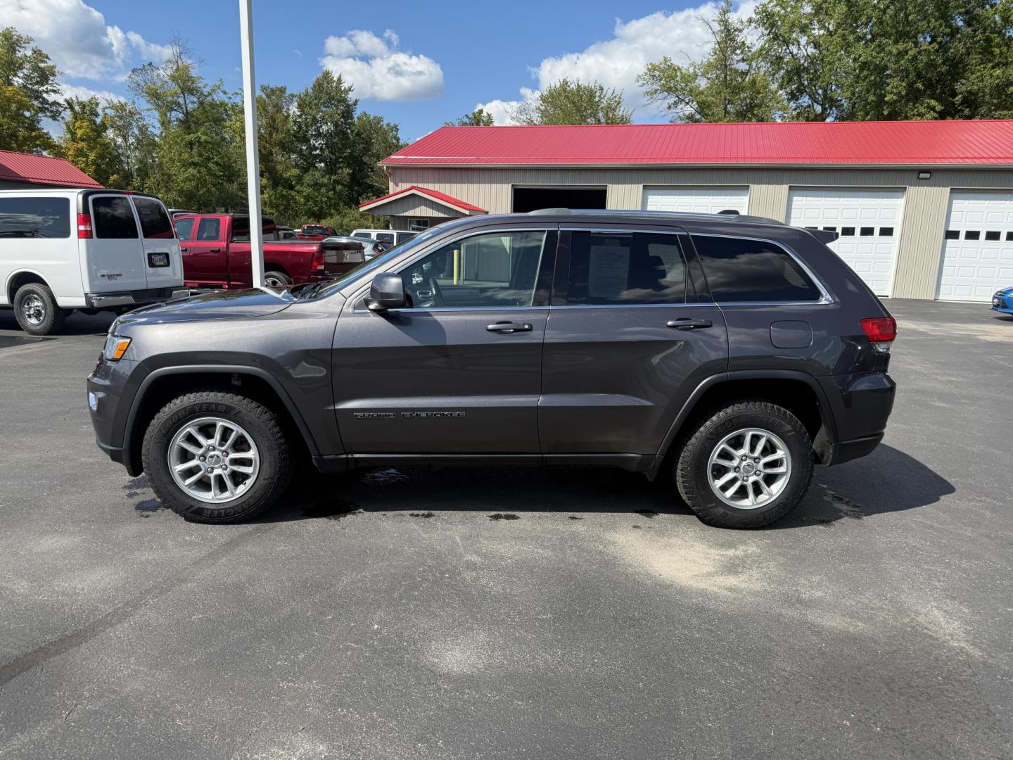 2019 Gray /Black Jeep Grand Cherokee Laredo E 4WD (1C4RJFAG7KC) with an 3.6L V6 DOHC 24V engine, 8A transmission, located at 547 E. Main St., Orwell, OH, 44076, (440) 437-5893, 41.535435, -80.847855 - This 2019 Jeep Grand Cherokee Laredo E 4WD features a 3.6L Pentastar V6 engine with an 8-speed automatic transmission and the Quadra-Trac 1 4WD system, delivering 25 MPG on the highway. Comfort and convenience are provided by a power driver’s seat, dual-zone automatic climate control, a 7.0" touch - Photo#12