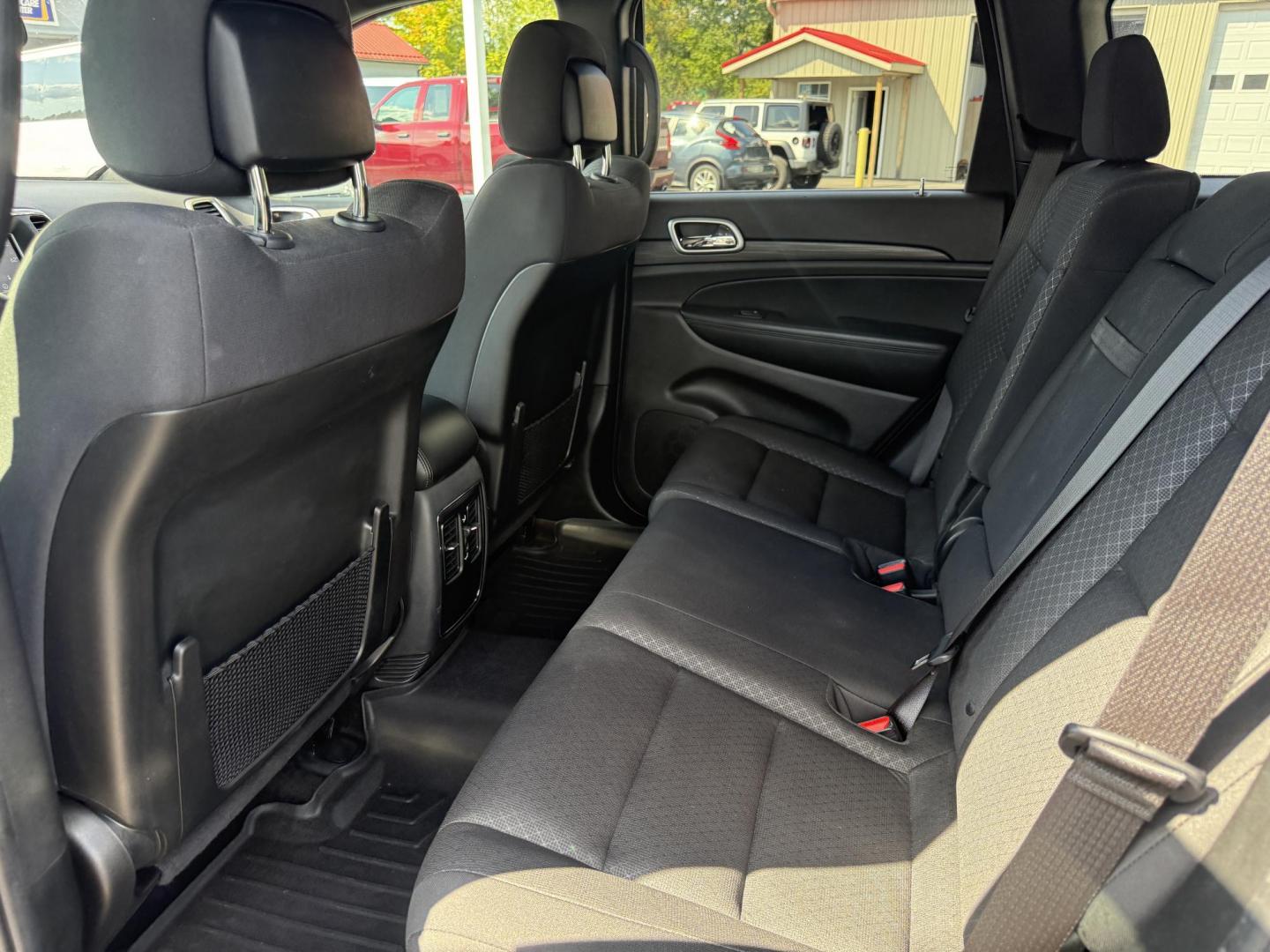 2019 Gray /Black Jeep Grand Cherokee Laredo E 4WD (1C4RJFAG7KC) with an 3.6L V6 DOHC 24V engine, 8A transmission, located at 547 E. Main St., Orwell, OH, 44076, (440) 437-5893, 41.535435, -80.847855 - This 2019 Jeep Grand Cherokee Laredo E 4WD features a 3.6L Pentastar V6 engine with an 8-speed automatic transmission and the Quadra-Trac 1 4WD system, delivering 25 MPG on the highway. Comfort and convenience are provided by a power driver’s seat, dual-zone automatic climate control, a 7.0" touch - Photo#31