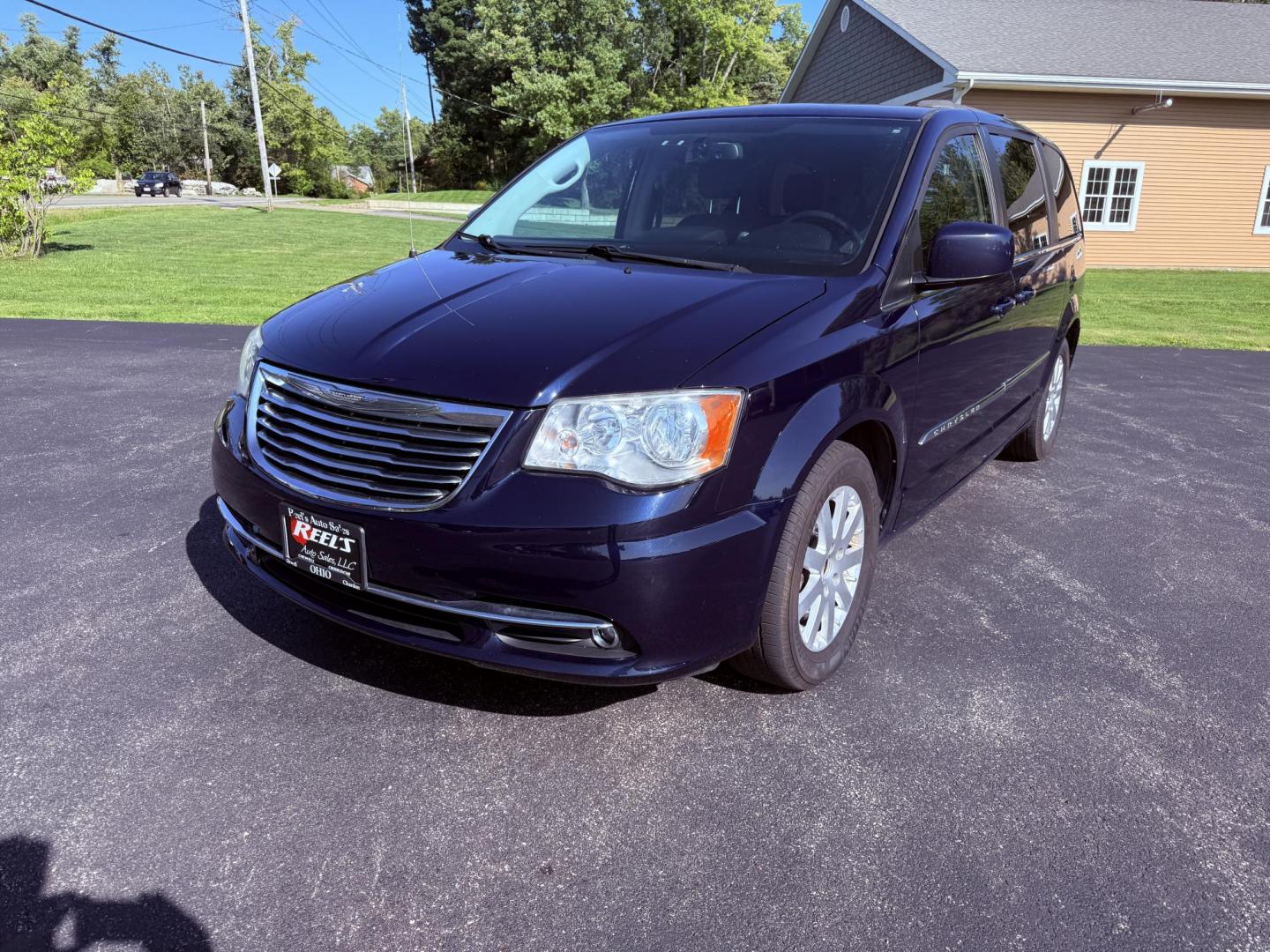 2015 Blue /Black Chrysler Town & Country Touring (2C4RC1BG0FR) with an 3.6L V6 DOHC 24V engine, 6-Speed Automatic transmission, located at 11115 Chardon Rd. , Chardon, OH, 44024, (440) 214-9705, 41.580246, -81.241943 - This 2015 Chrysler Town & Country Touring features a 3.6L Pentastar V6 engine paired with a 6-speed automatic transmission, and comes equipped with premium amenities including leather interior, tri-zone automatic climate control, Stow 'n Go seating for versatile cargo and passenger arrangements, a b - Photo#0