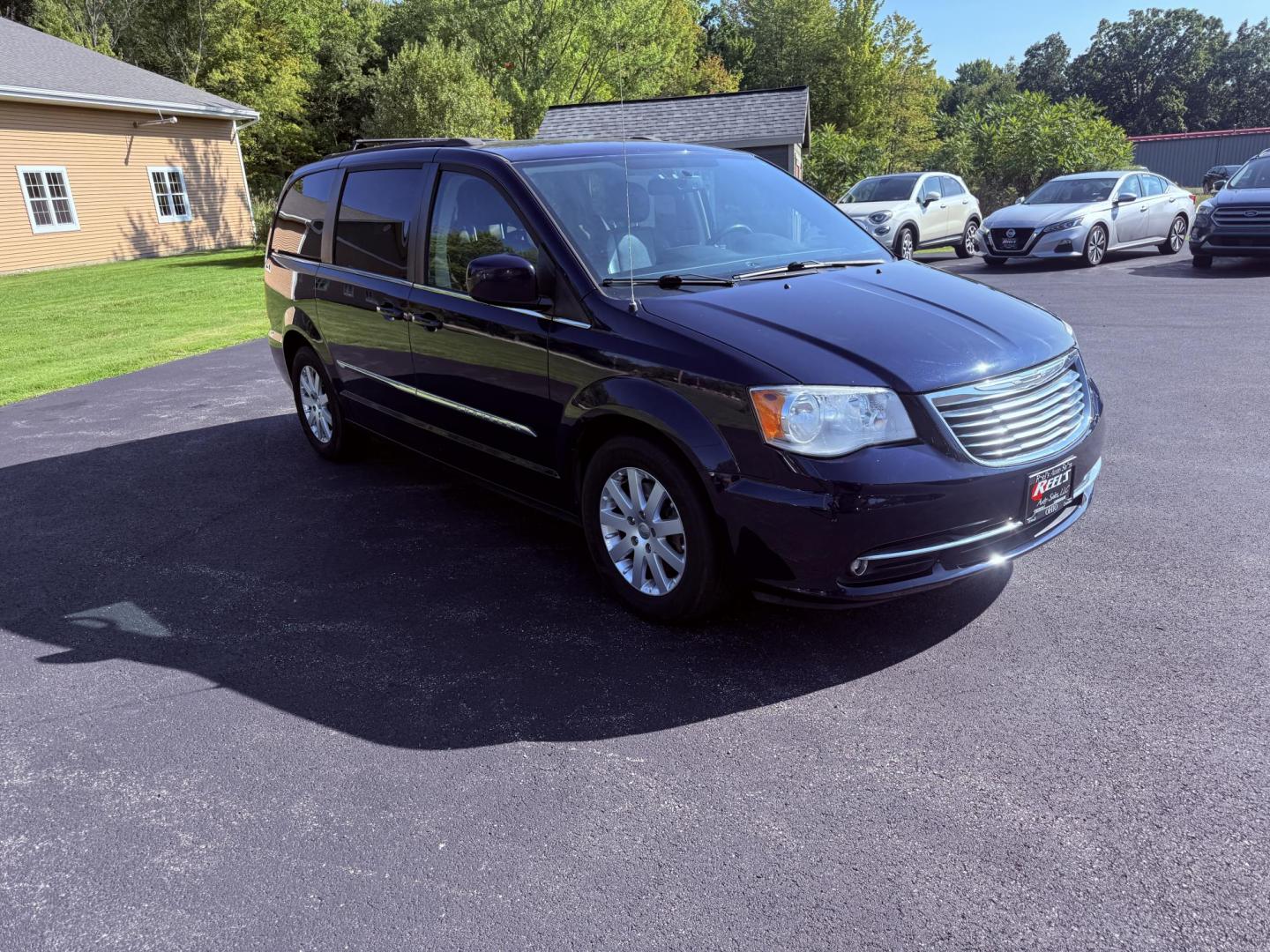 2015 Blue /Black Chrysler Town & Country Touring (2C4RC1BG0FR) with an 3.6L V6 DOHC 24V engine, 6-Speed Automatic transmission, located at 11115 Chardon Rd. , Chardon, OH, 44024, (440) 214-9705, 41.580246, -81.241943 - This 2015 Chrysler Town & Country Touring features a 3.6L Pentastar V6 engine paired with a 6-speed automatic transmission, and comes equipped with premium amenities including leather interior, tri-zone automatic climate control, Stow 'n Go seating for versatile cargo and passenger arrangements, a b - Photo#2