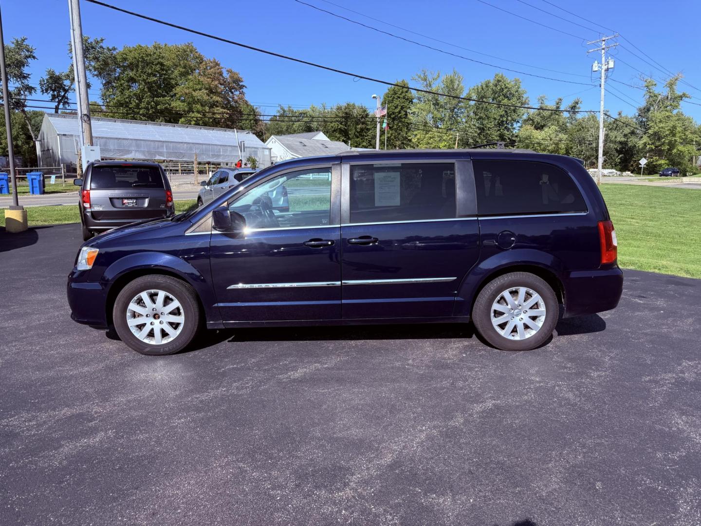 2015 Blue /Black Chrysler Town & Country Touring (2C4RC1BG0FR) with an 3.6L V6 DOHC 24V engine, 6-Speed Automatic transmission, located at 11115 Chardon Rd. , Chardon, OH, 44024, (440) 214-9705, 41.580246, -81.241943 - This 2015 Chrysler Town & Country Touring features a 3.6L Pentastar V6 engine paired with a 6-speed automatic transmission, and comes equipped with premium amenities including leather interior, tri-zone automatic climate control, Stow 'n Go seating for versatile cargo and passenger arrangements, a b - Photo#12