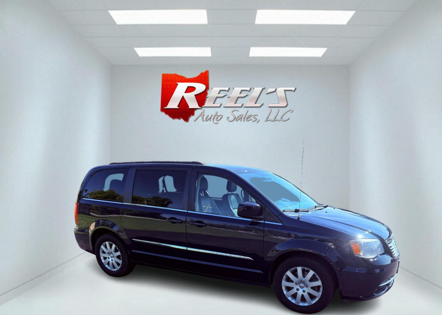 2015 Blue /Black Chrysler Town & Country Touring (2C4RC1BG0FR) with an 3.6L V6 DOHC 24V engine, 6-Speed Automatic transmission, located at 11115 Chardon Rd. , Chardon, OH, 44024, (440) 214-9705, 41.580246, -81.241943 - This 2015 Chrysler Town & Country Touring features a 3.6L Pentastar V6 engine paired with a 6-speed automatic transmission, and comes equipped with premium amenities including leather interior, tri-zone automatic climate control, Stow 'n Go seating for versatile cargo and passenger arrangements, a b - Photo#4