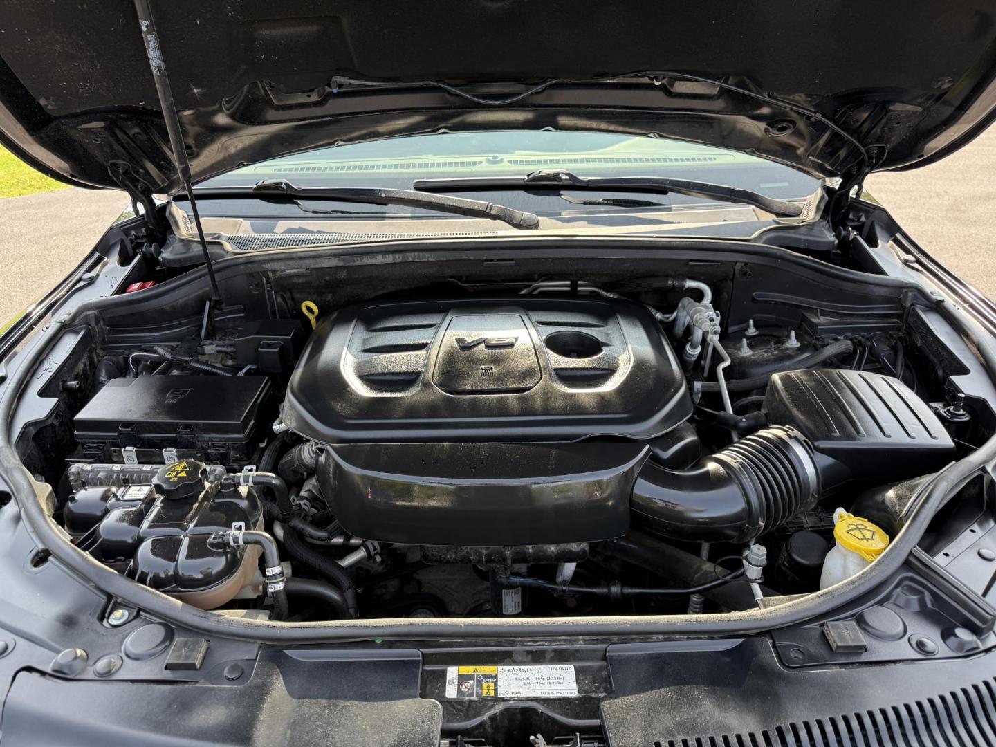 2019 Black /Black Dodge Durango GT Plus AWD (1C4RDJDGXKC) with an 3.6L V6 DOHC 24V engine, 8A transmission, located at 547 E. Main St., Orwell, OH, 44076, (440) 437-5893, 41.535435, -80.847855 - The 2019 Dodge Durango GT Plus AWD is a versatile SUV powered by a 3.6L Pentastar V6 engine paired with an 8-speed automatic transmission, offering 25 MPG on the highway and a 3,500-pound towing capacity. It features a leather interior with power front seats, heated front and second-row seats, tri-z - Photo#14