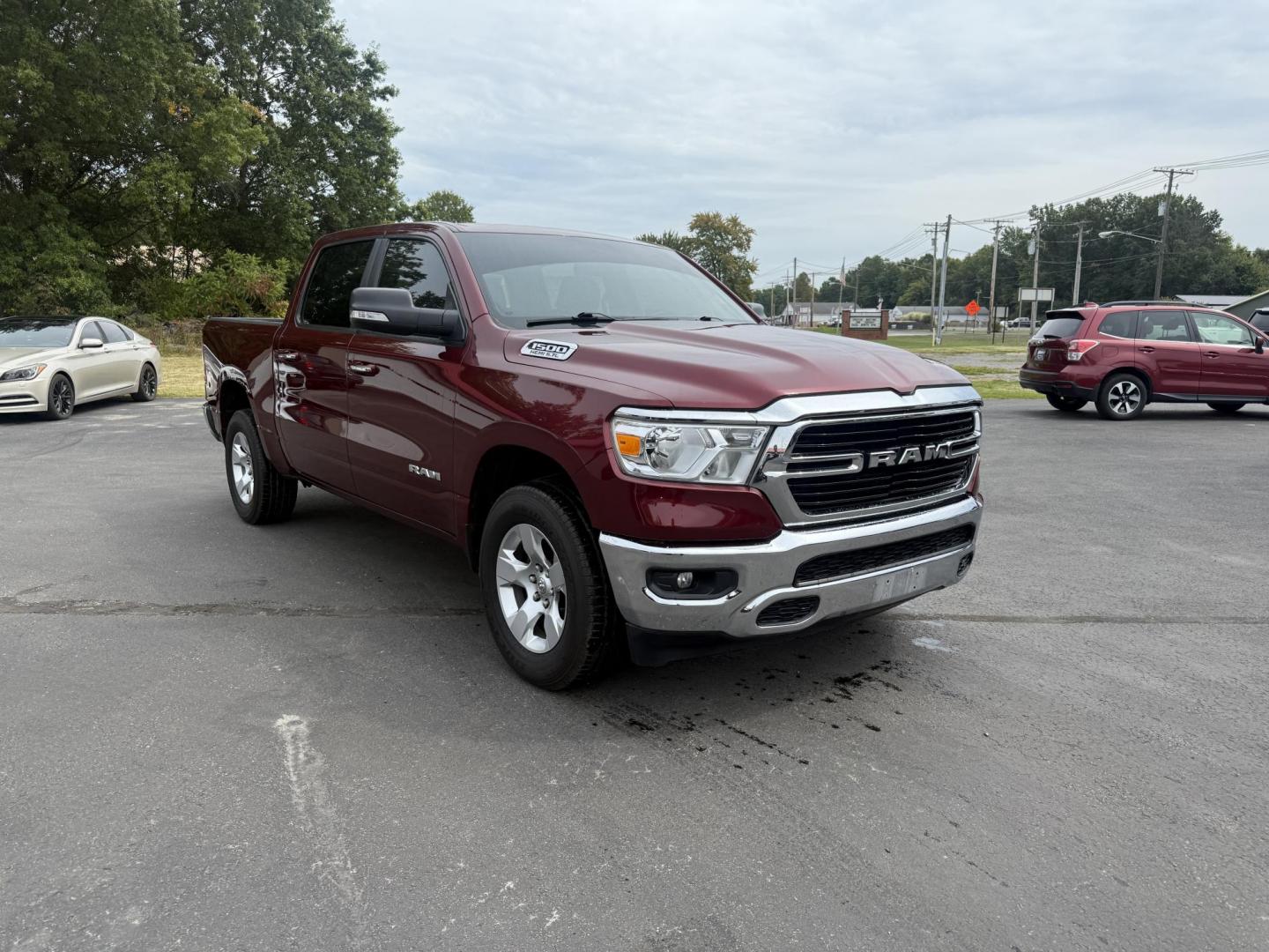 2019 Red /Black RAM 1500 Big Horn Crew Cab SWB 4WD (1C6SRFFTXKN) with an 5.7L V8 OHV 16V engine, Automatic transmission, located at 547 E. Main St., Orwell, OH, 44076, (440) 437-5893, 41.535435, -80.847855 - This 2019 Ram 1500 Big Horn Crew Cab 4WD with a 5.7L HEMI V8 and 8-speed automatic transmission offers robust performance with 395 horsepower and 410 lb-ft of torque, featuring a 3.92 axle ratio for a strong 11,340-pound towing capacity. It balances power with comfort and technology, boasting a 3.5" - Photo#2