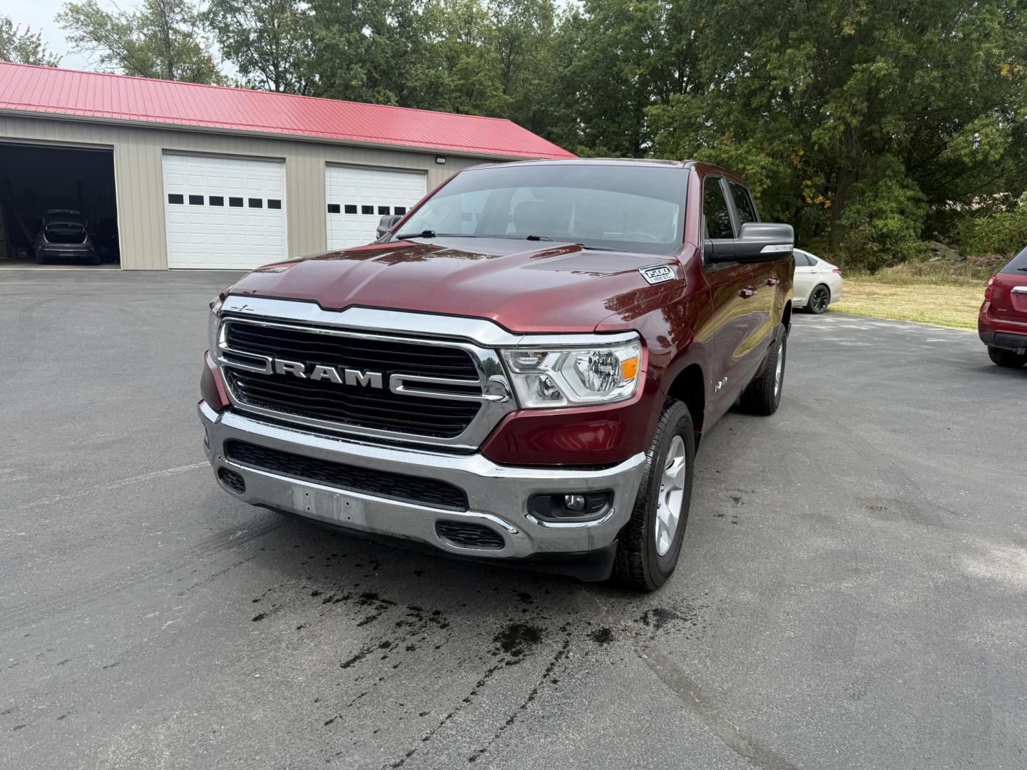 2019 Red /Black RAM 1500 Big Horn Crew Cab SWB 4WD (1C6SRFFTXKN) with an 5.7L V8 OHV 16V engine, Automatic transmission, located at 547 E. Main St., Orwell, OH, 44076, (440) 437-5893, 41.535435, -80.847855 - This 2019 Ram 1500 Big Horn Crew Cab 4WD with a 5.7L HEMI V8 and 8-speed automatic transmission offers robust performance with 395 horsepower and 410 lb-ft of torque, featuring a 3.92 axle ratio for a strong 11,340-pound towing capacity. It balances power with comfort and technology, boasting a 3.5" - Photo#0