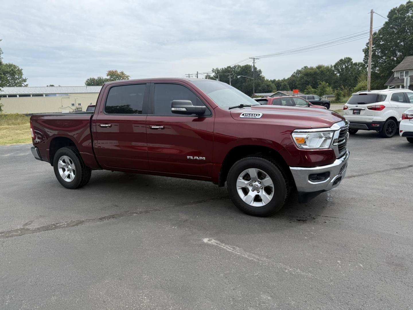 2019 Red /Black RAM 1500 Big Horn Crew Cab SWB 4WD (1C6SRFFTXKN) with an 5.7L V8 OHV 16V engine, Automatic transmission, located at 547 E. Main St., Orwell, OH, 44076, (440) 437-5893, 41.535435, -80.847855 - This 2019 Ram 1500 Big Horn Crew Cab 4WD with a 5.7L HEMI V8 and 8-speed automatic transmission offers robust performance with 395 horsepower and 410 lb-ft of torque, featuring a 3.92 axle ratio for a strong 11,340-pound towing capacity. It balances power with comfort and technology, boasting a 3.5" - Photo#3