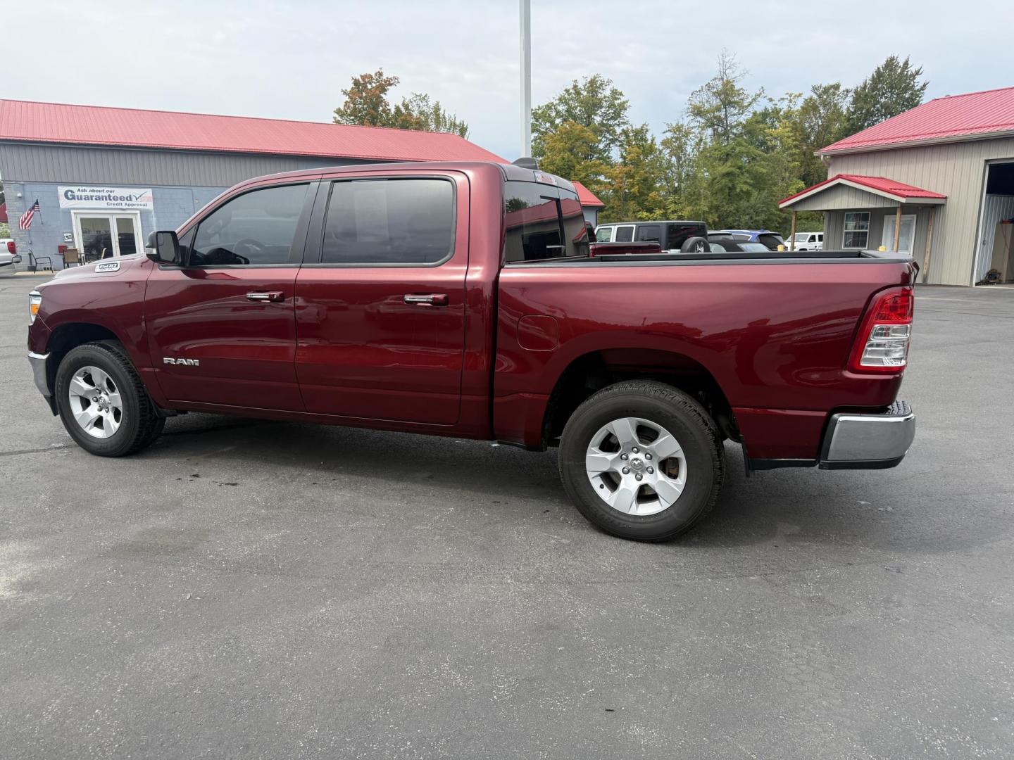 2019 Red /Black RAM 1500 Big Horn Crew Cab SWB 4WD (1C6SRFFTXKN) with an 5.7L V8 OHV 16V engine, Automatic transmission, located at 547 E. Main St., Orwell, OH, 44076, (440) 437-5893, 41.535435, -80.847855 - This 2019 Ram 1500 Big Horn Crew Cab 4WD with a 5.7L HEMI V8 and 8-speed automatic transmission offers robust performance with 395 horsepower and 410 lb-ft of torque, featuring a 3.92 axle ratio for a strong 11,340-pound towing capacity. It balances power with comfort and technology, boasting a 3.5" - Photo#12
