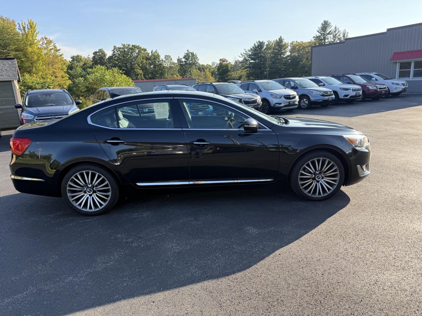 2015 Black /Black Kia Cadenza Premium (KNALN4D72F5) with an 3.3L V6 DOHC 24V engine, 6-Speed Automatic transmission, located at 11115 Chardon Rd. , Chardon, OH, 44024, (440) 214-9705, 41.580246, -81.241943 - This 2015 Kia Cadenza Premium offers a refined driving experience with its 3.3L V6 engine and 6-speed automatic transmission, achieving up to 28 MPG on the highway. Its upscale interior features Nappa leather, heated and cooled power front seats, heated rear seats, dual-zone automatic climate contro - Photo#5