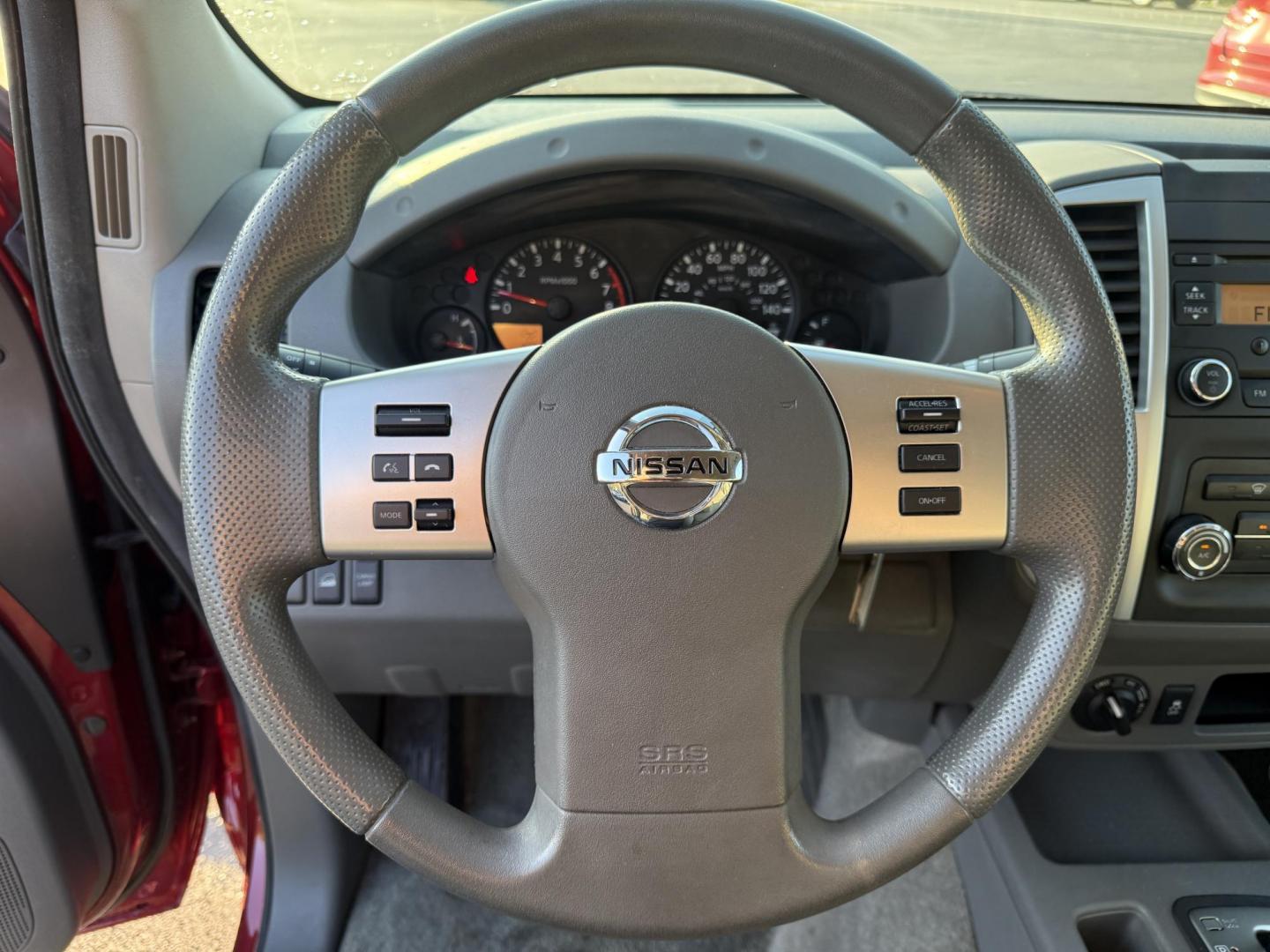 2015 Red /Gray Nissan Frontier S Crew Cab 5AT 4WD (1N6AD0EV7FN) with an 4.0L V6 DOHC 24V engine, 5-Speed Automatic transmission, located at 11115 Chardon Rd. , Chardon, OH, 44024, (440) 214-9705, 41.580246, -81.241943 - This One Owner 2015 Nissan Frontier S Crew Cab 4WD is powered by a robust 4.0L V6 engine mated to a 5-speed automatic transmission, offering a towing capacity of up to 6,100 pounds. It features a Dana 44 rear axle and active brake limited slip differentials, enhancing traction and off-road capabilit - Photo#22