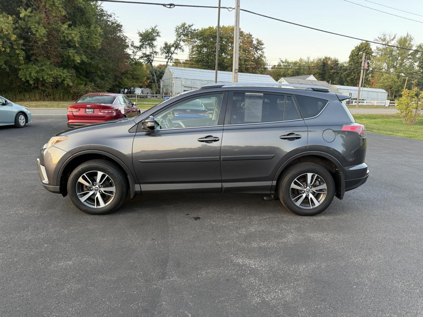 2017 Gray /Black Toyota RAV4 XLE AWD (JTMRFREV4HJ) with an 2.5L I4 DOHC 16V engine, 6A transmission, located at 11115 Chardon Rd. , Chardon, OH, 44024, (440) 214-9705, 41.580246, -81.241943 - One Owner 2017 Toyota RAV4 XLE AWD – Reliable, Versatile, and Packed with Safety Features! Drive with confidence in this one-owner 2017 Toyota RAV4 XLE AWD. Powered by a fuel-efficient 2.5L I4 engine with a 6-speed automatic transmission, this SUV delivers a smooth ride and impressive efficiency - Photo#12