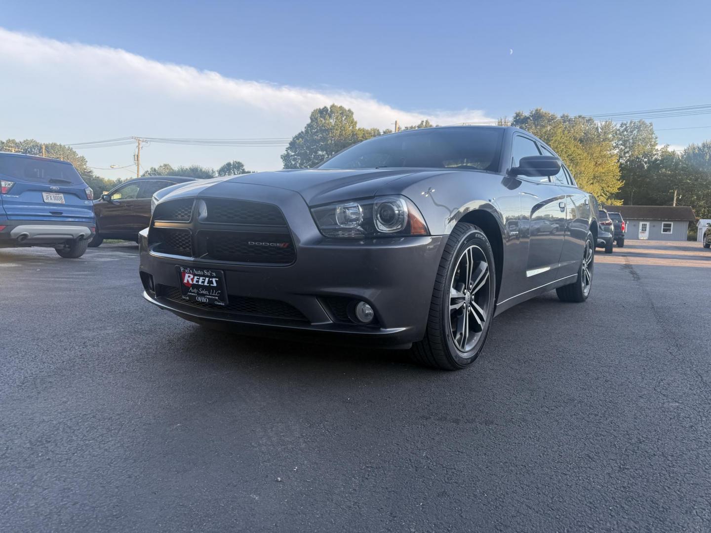 2014 Gray /Black Dodge Charger R/T AWD (2C3CDXDT6EH) with an 5.7L V8 OHV 16V engine, 5-Speed Automatic transmission, located at 547 E. Main St., Orwell, OH, 44076, (440) 437-5893, 41.535435, -80.847855 - This 2014 Dodge Charger R/T AWD is a powerful and stylish full-size sedan equipped with a 5.7L HEMI V8 engine that delivers 370 horsepower and 395 lb-ft of torque. Featuring a 5-speed automatic transmission and all-wheel drive, it accelerates from 0 to 60 mph in approximately 5.2 seconds, offering i - Photo#0