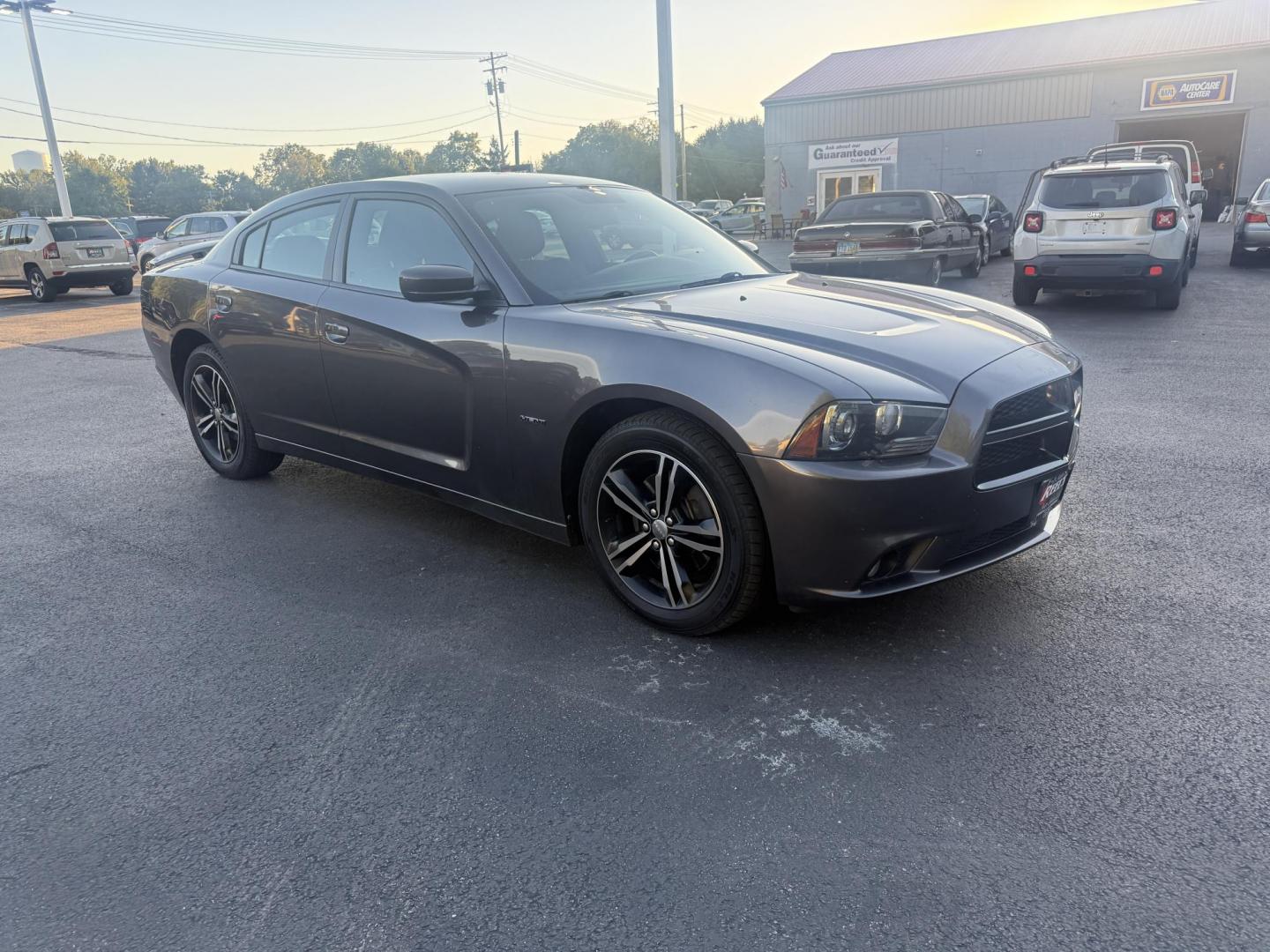 2014 Gray /Black Dodge Charger R/T AWD (2C3CDXDT6EH) with an 5.7L V8 OHV 16V engine, 5-Speed Automatic transmission, located at 547 E. Main St., Orwell, OH, 44076, (440) 437-5893, 41.535435, -80.847855 - This 2014 Dodge Charger R/T AWD is a powerful and stylish full-size sedan equipped with a 5.7L HEMI V8 engine that delivers 370 horsepower and 395 lb-ft of torque. Featuring a 5-speed automatic transmission and all-wheel drive, it accelerates from 0 to 60 mph in approximately 5.2 seconds, offering i - Photo#2