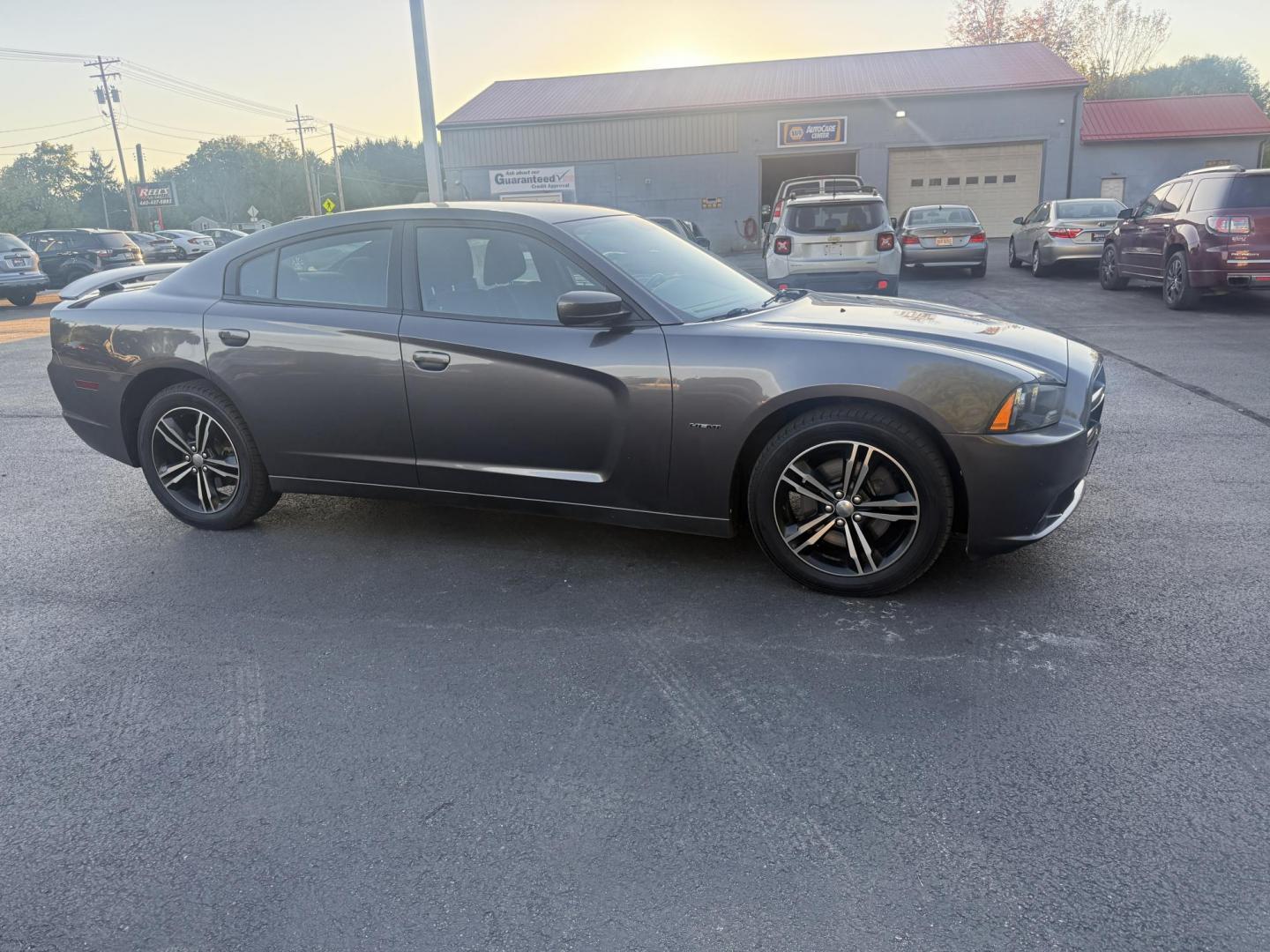 2014 Gray /Black Dodge Charger R/T AWD (2C3CDXDT6EH) with an 5.7L V8 OHV 16V engine, 5-Speed Automatic transmission, located at 547 E. Main St., Orwell, OH, 44076, (440) 437-5893, 41.535435, -80.847855 - This 2014 Dodge Charger R/T AWD is a powerful and stylish full-size sedan equipped with a 5.7L HEMI V8 engine that delivers 370 horsepower and 395 lb-ft of torque. Featuring a 5-speed automatic transmission and all-wheel drive, it accelerates from 0 to 60 mph in approximately 5.2 seconds, offering i - Photo#3