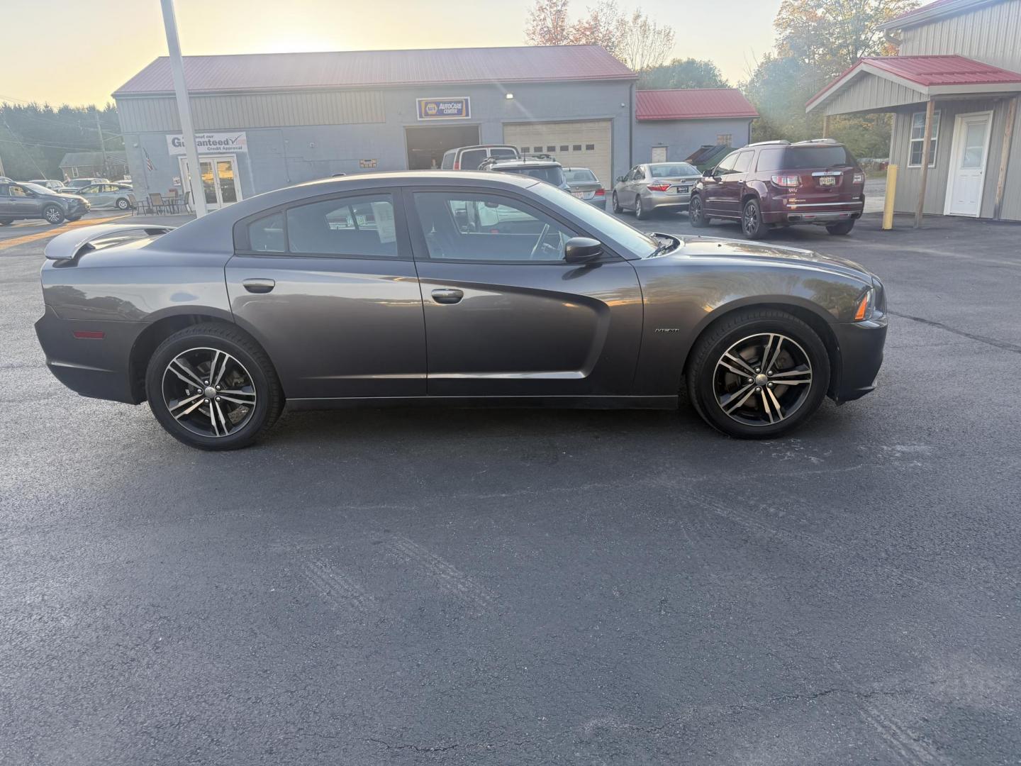 2014 Gray /Black Dodge Charger R/T AWD (2C3CDXDT6EH) with an 5.7L V8 OHV 16V engine, 5-Speed Automatic transmission, located at 547 E. Main St., Orwell, OH, 44076, (440) 437-5893, 41.535435, -80.847855 - This 2014 Dodge Charger R/T AWD is a powerful and stylish full-size sedan equipped with a 5.7L HEMI V8 engine that delivers 370 horsepower and 395 lb-ft of torque. Featuring a 5-speed automatic transmission and all-wheel drive, it accelerates from 0 to 60 mph in approximately 5.2 seconds, offering i - Photo#5