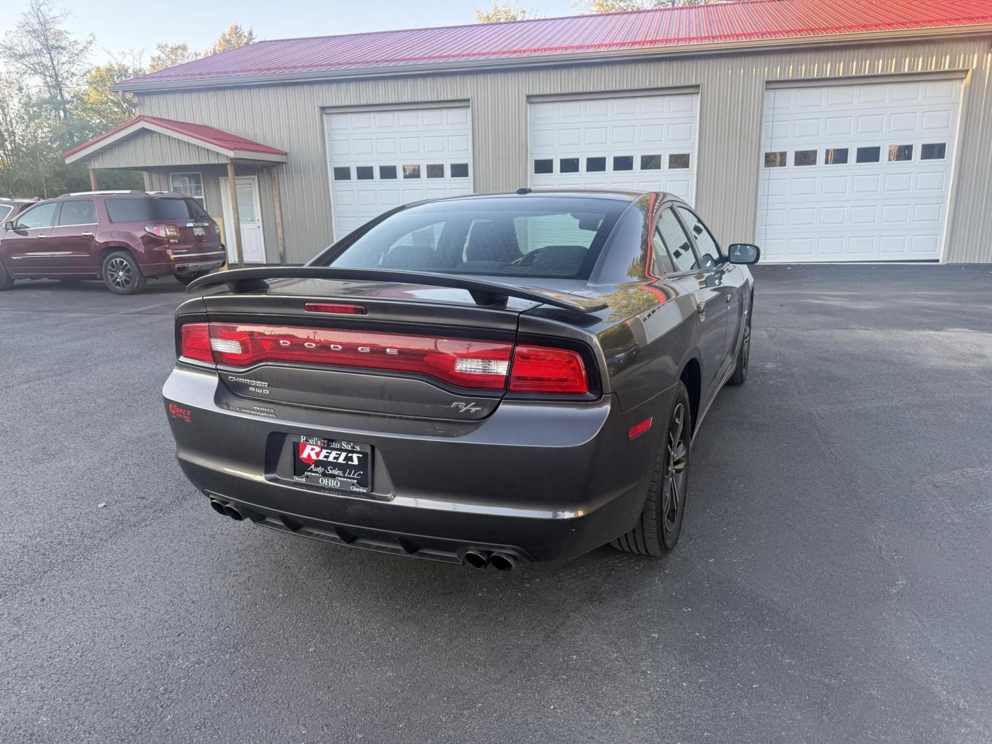 2014 Gray /Black Dodge Charger R/T AWD (2C3CDXDT6EH) with an 5.7L V8 OHV 16V engine, 5-Speed Automatic transmission, located at 547 E. Main St., Orwell, OH, 44076, (440) 437-5893, 41.535435, -80.847855 - This 2014 Dodge Charger R/T AWD is a powerful and stylish full-size sedan equipped with a 5.7L HEMI V8 engine that delivers 370 horsepower and 395 lb-ft of torque. Featuring a 5-speed automatic transmission and all-wheel drive, it accelerates from 0 to 60 mph in approximately 5.2 seconds, offering i - Photo#7