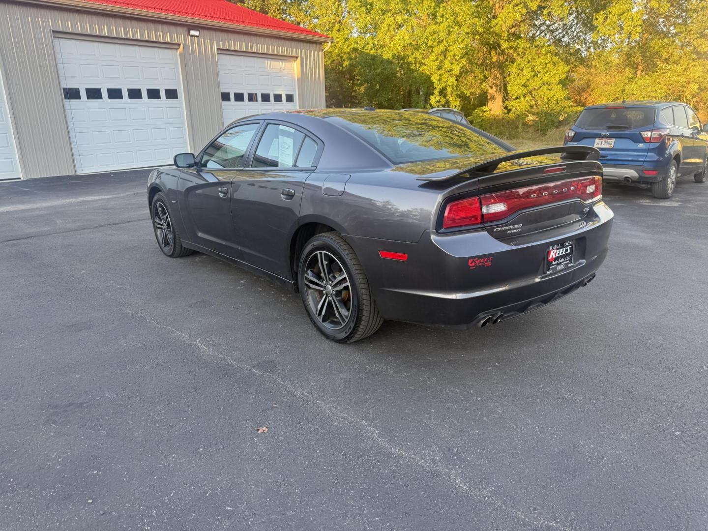 2014 Gray /Black Dodge Charger R/T AWD (2C3CDXDT6EH) with an 5.7L V8 OHV 16V engine, 5-Speed Automatic transmission, located at 547 E. Main St., Orwell, OH, 44076, (440) 437-5893, 41.535435, -80.847855 - This 2014 Dodge Charger R/T AWD is a powerful and stylish full-size sedan equipped with a 5.7L HEMI V8 engine that delivers 370 horsepower and 395 lb-ft of torque. Featuring a 5-speed automatic transmission and all-wheel drive, it accelerates from 0 to 60 mph in approximately 5.2 seconds, offering i - Photo#9