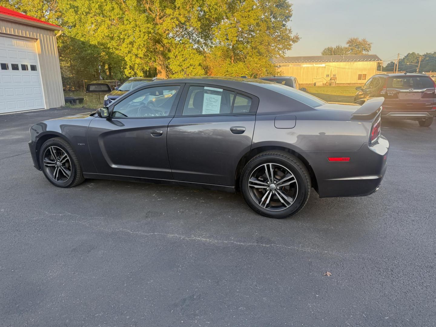 2014 Gray /Black Dodge Charger R/T AWD (2C3CDXDT6EH) with an 5.7L V8 OHV 16V engine, 5-Speed Automatic transmission, located at 547 E. Main St., Orwell, OH, 44076, (440) 437-5893, 41.535435, -80.847855 - This 2014 Dodge Charger R/T AWD is a powerful and stylish full-size sedan equipped with a 5.7L HEMI V8 engine that delivers 370 horsepower and 395 lb-ft of torque. Featuring a 5-speed automatic transmission and all-wheel drive, it accelerates from 0 to 60 mph in approximately 5.2 seconds, offering i - Photo#10