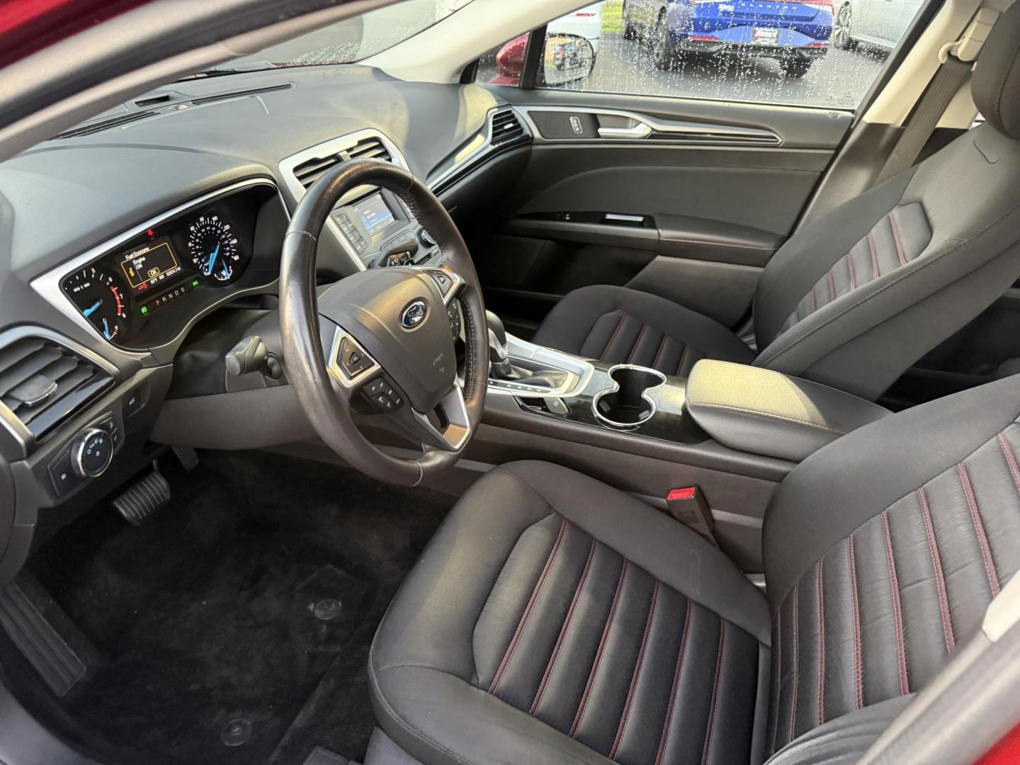 2015 Red /Black Ford Fusion SE (3FA6P0H98FR) with an 2.0L I4 DOHC 16V Turbo engine, 6-Speed Automatic transmission, located at 11115 Chardon Rd. , Chardon, OH, 44024, (440) 214-9705, 41.580246, -81.241943 - This One Owner 2015 Ford Fusion SE is a stylish and efficient midsize sedan powered by a 2.0L I4 EcoBoost engine paired with a 6-speed automatic transmission. This combination delivers a satisfying balance of performance and fuel economy, achieving up to 33 MPG on the highway. The SE trim offers com - Photo#15