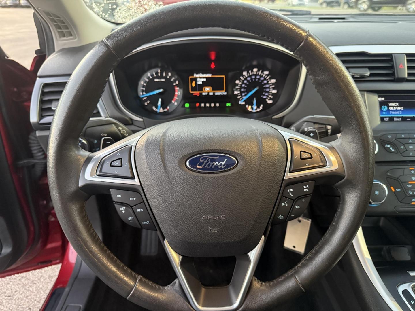 2015 Red /Black Ford Fusion SE (3FA6P0H98FR) with an 2.0L I4 DOHC 16V Turbo engine, 6-Speed Automatic transmission, located at 11115 Chardon Rd. , Chardon, OH, 44024, (440) 214-9705, 41.580246, -81.241943 - This One Owner 2015 Ford Fusion SE is a stylish and efficient midsize sedan powered by a 2.0L I4 EcoBoost engine paired with a 6-speed automatic transmission. This combination delivers a satisfying balance of performance and fuel economy, achieving up to 33 MPG on the highway. The SE trim offers com - Photo#24