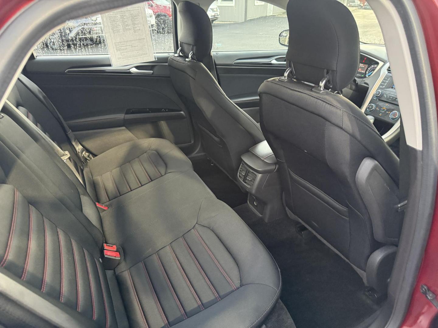 2015 Red /Black Ford Fusion SE (3FA6P0H98FR) with an 2.0L I4 DOHC 16V Turbo engine, 6-Speed Automatic transmission, located at 11115 Chardon Rd. , Chardon, OH, 44024, (440) 214-9705, 41.580246, -81.241943 - This One Owner 2015 Ford Fusion SE is a stylish and efficient midsize sedan powered by a 2.0L I4 EcoBoost engine paired with a 6-speed automatic transmission. This combination delivers a satisfying balance of performance and fuel economy, achieving up to 33 MPG on the highway. The SE trim offers com - Photo#37
