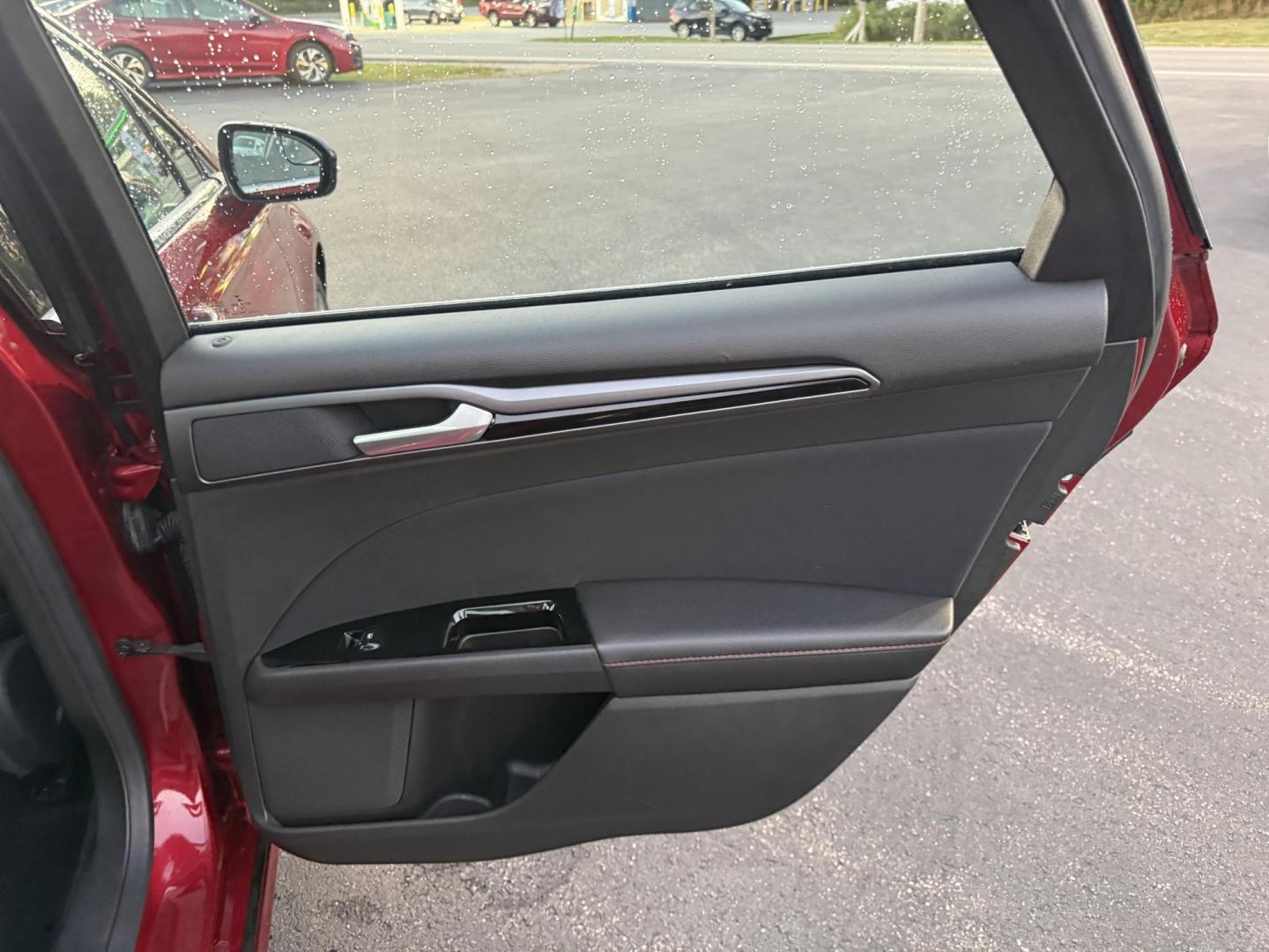 2015 Red /Black Ford Fusion SE (3FA6P0H98FR) with an 2.0L I4 DOHC 16V Turbo engine, 6-Speed Automatic transmission, located at 11115 Chardon Rd. , Chardon, OH, 44024, (440) 214-9705, 41.580246, -81.241943 - This One Owner 2015 Ford Fusion SE is a stylish and efficient midsize sedan powered by a 2.0L I4 EcoBoost engine paired with a 6-speed automatic transmission. This combination delivers a satisfying balance of performance and fuel economy, achieving up to 33 MPG on the highway. The SE trim offers com - Photo#38