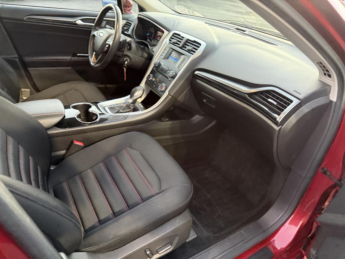 2015 Red /Black Ford Fusion SE (3FA6P0H98FR) with an 2.0L I4 DOHC 16V Turbo engine, 6-Speed Automatic transmission, located at 11115 Chardon Rd. , Chardon, OH, 44024, (440) 214-9705, 41.580246, -81.241943 - This One Owner 2015 Ford Fusion SE is a stylish and efficient midsize sedan powered by a 2.0L I4 EcoBoost engine paired with a 6-speed automatic transmission. This combination delivers a satisfying balance of performance and fuel economy, achieving up to 33 MPG on the highway. The SE trim offers com - Photo#39