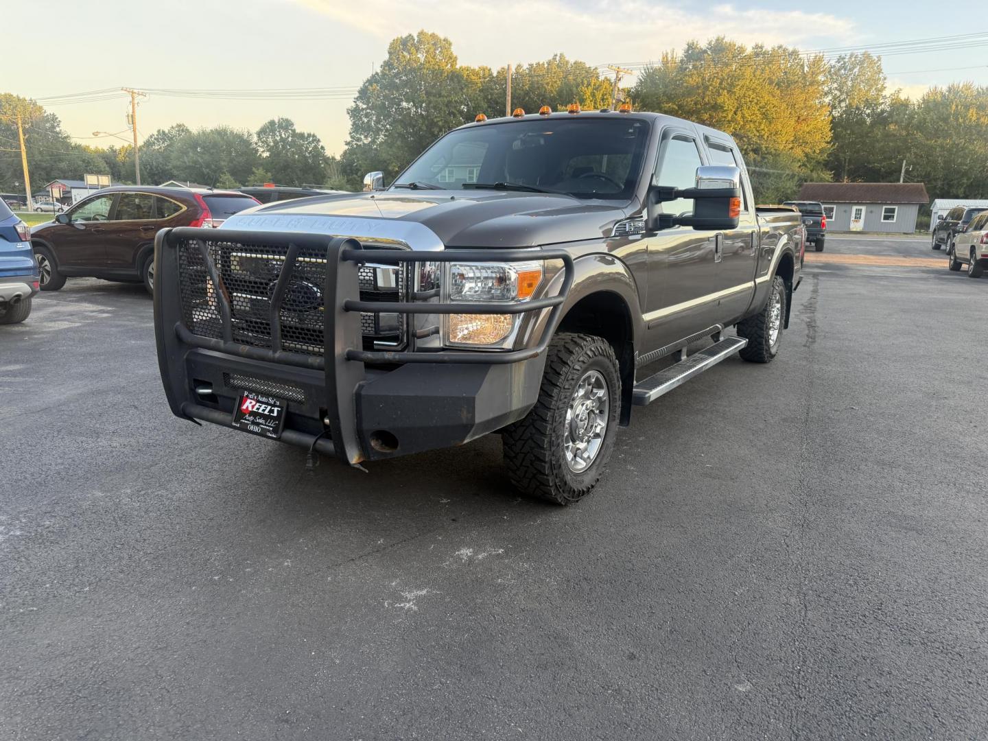 2016 Tan /Gray Ford F-250 SD XLT Crew Cab 4WD (1FT7W2B61GE) with an 6.2L V8 OHV 16V engine, 6-Speed Automatic transmission, located at 547 E. Main St., Orwell, OH, 44076, (440) 437-5893, 41.535435, -80.847855 - This 2016 Ford F-250 XLT Crew Cab is a powerful and capable heavy-duty pickup truck, equipped with a robust 6.2L V8 engine and a 6-speed automatic transmission. Designed for serious work, it features 3.73 gearing and boasts an impressive towing capacity of up to 12,500 pounds, making it ideal for ha - Photo#0