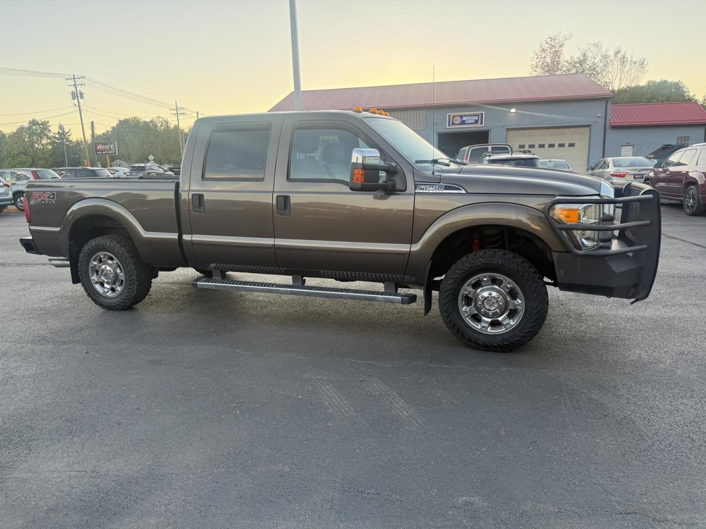 2016 Tan /Gray Ford F-250 SD XLT Crew Cab 4WD (1FT7W2B61GE) with an 6.2L V8 OHV 16V engine, 6-Speed Automatic transmission, located at 547 E. Main St., Orwell, OH, 44076, (440) 437-5893, 41.535435, -80.847855 - This 2016 Ford F-250 XLT Crew Cab is a powerful and capable heavy-duty pickup truck, equipped with a robust 6.2L V8 engine and a 6-speed automatic transmission. Designed for serious work, it features 3.73 gearing and boasts an impressive towing capacity of up to 12,500 pounds, making it ideal for ha - Photo#3