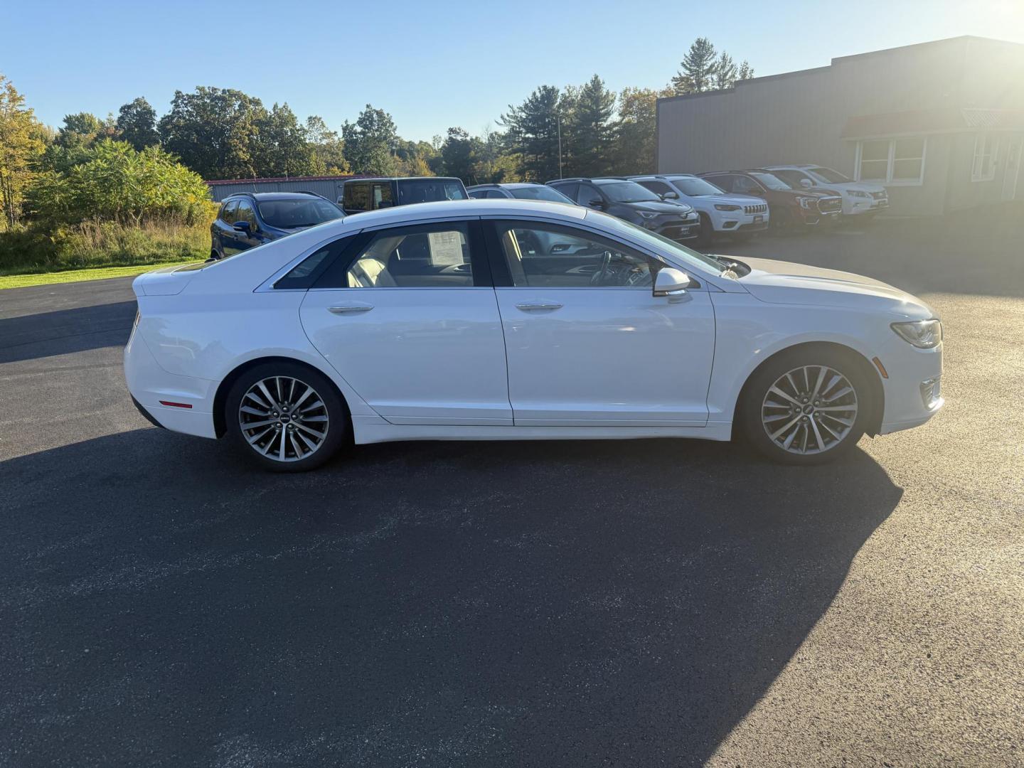 2017 White /White Lincoln MKZ Hybrid Select (3LN6L5LU2HR) with an 2.0L L4 DOHC 16V HYBRID engine, Automatic transmission, located at 547 E. Main St., Orwell, OH, 44076, (440) 437-5893, 41.535435, -80.847855 - Photo#5