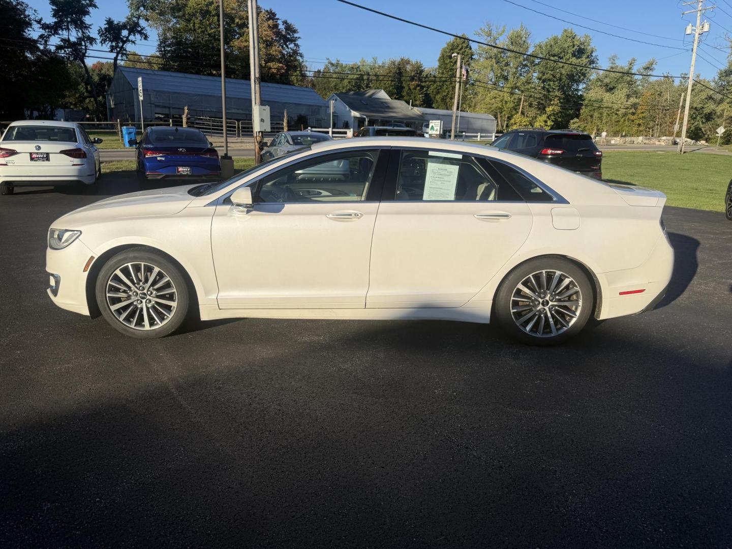 2017 White /White Lincoln MKZ Hybrid Select (3LN6L5LU2HR) with an 2.0L L4 DOHC 16V HYBRID engine, Automatic transmission, located at 547 E. Main St., Orwell, OH, 44076, (440) 437-5893, 41.535435, -80.847855 - Photo#12